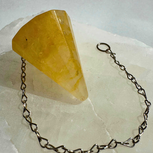 Golden Healer Crystal Pendulum with faceted point and silver chain, ideal for dowsing, divination, and energy healing practices | Bespoke Crystals NZ