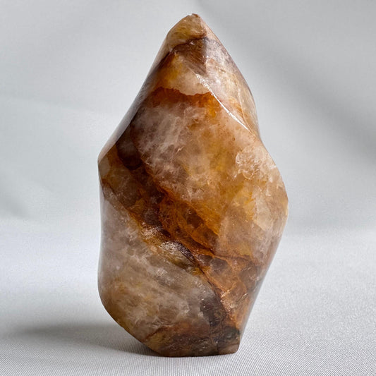 Golden Healer Flame crystal sculpture with rich amber and honey tones, ideal for healing energy work and spiritual growth in crystal collections.