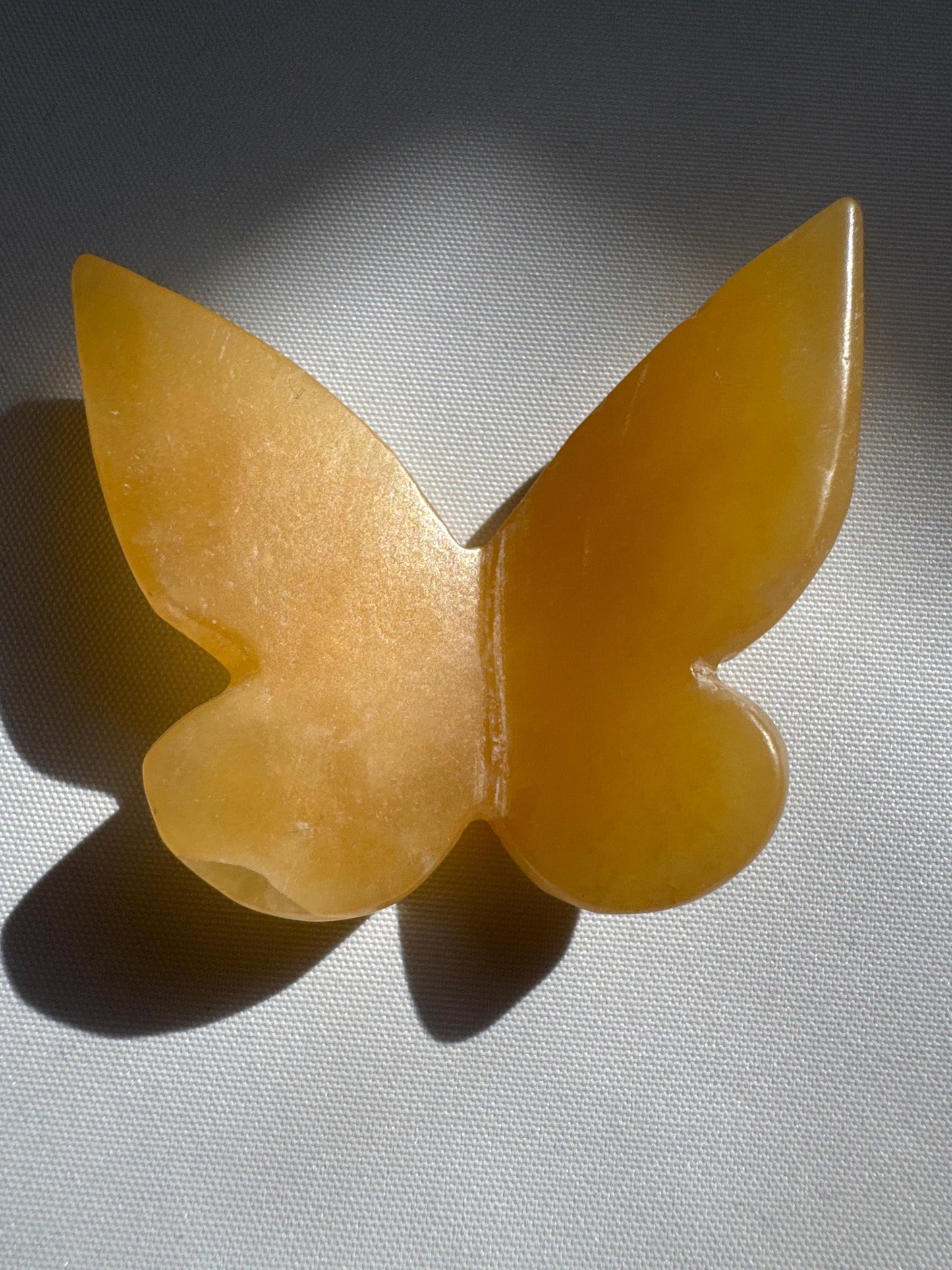 Orange Calcite Crystal 3D Butterfly with warm golden tones and smooth finish, ideal for hobbyists and crystal collectors.