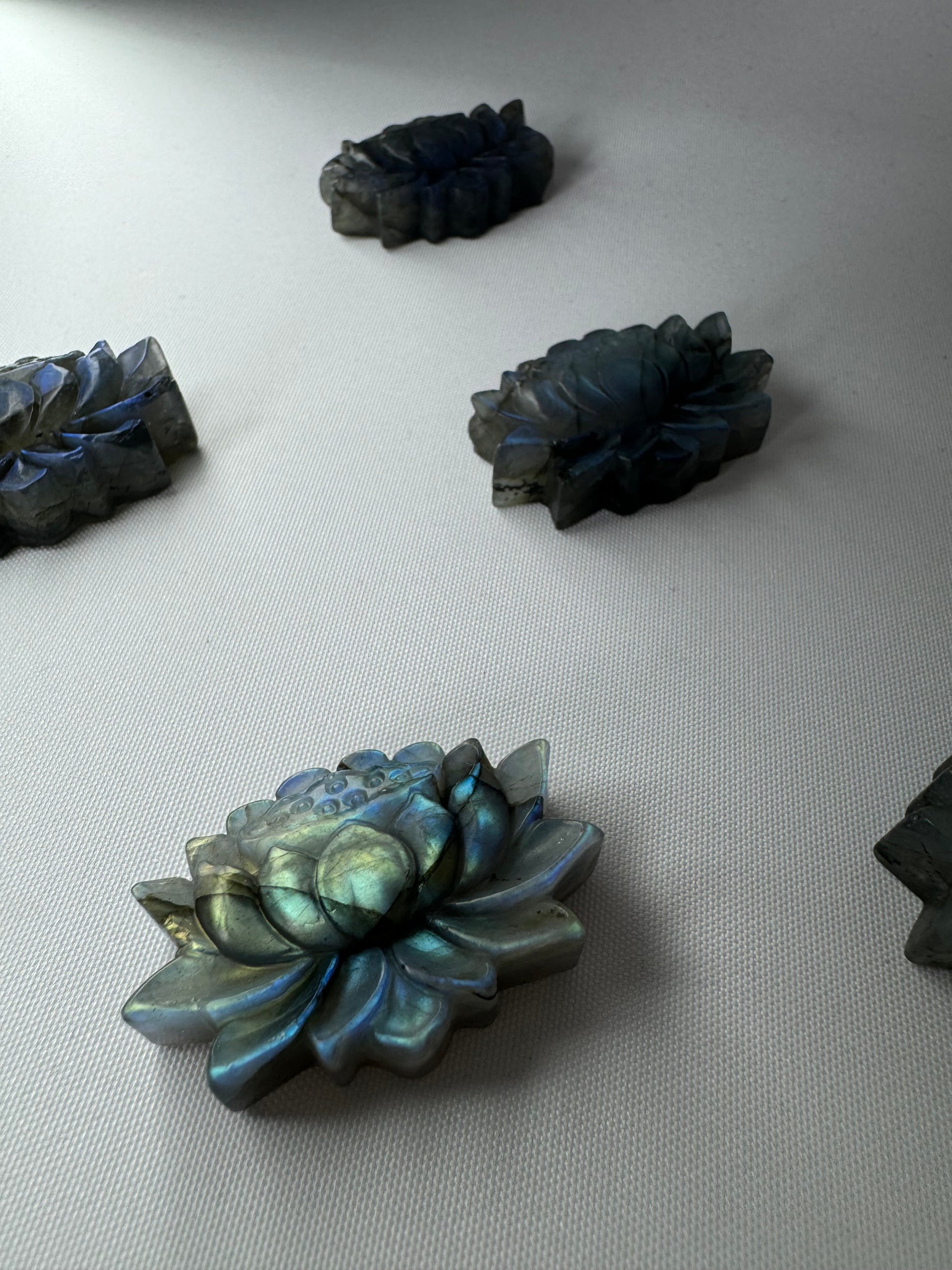 Labradorite Crystal Lotus Carving | Bespoke Crystals showcasing iridescent rainbow hues and intricate lotus detailing.