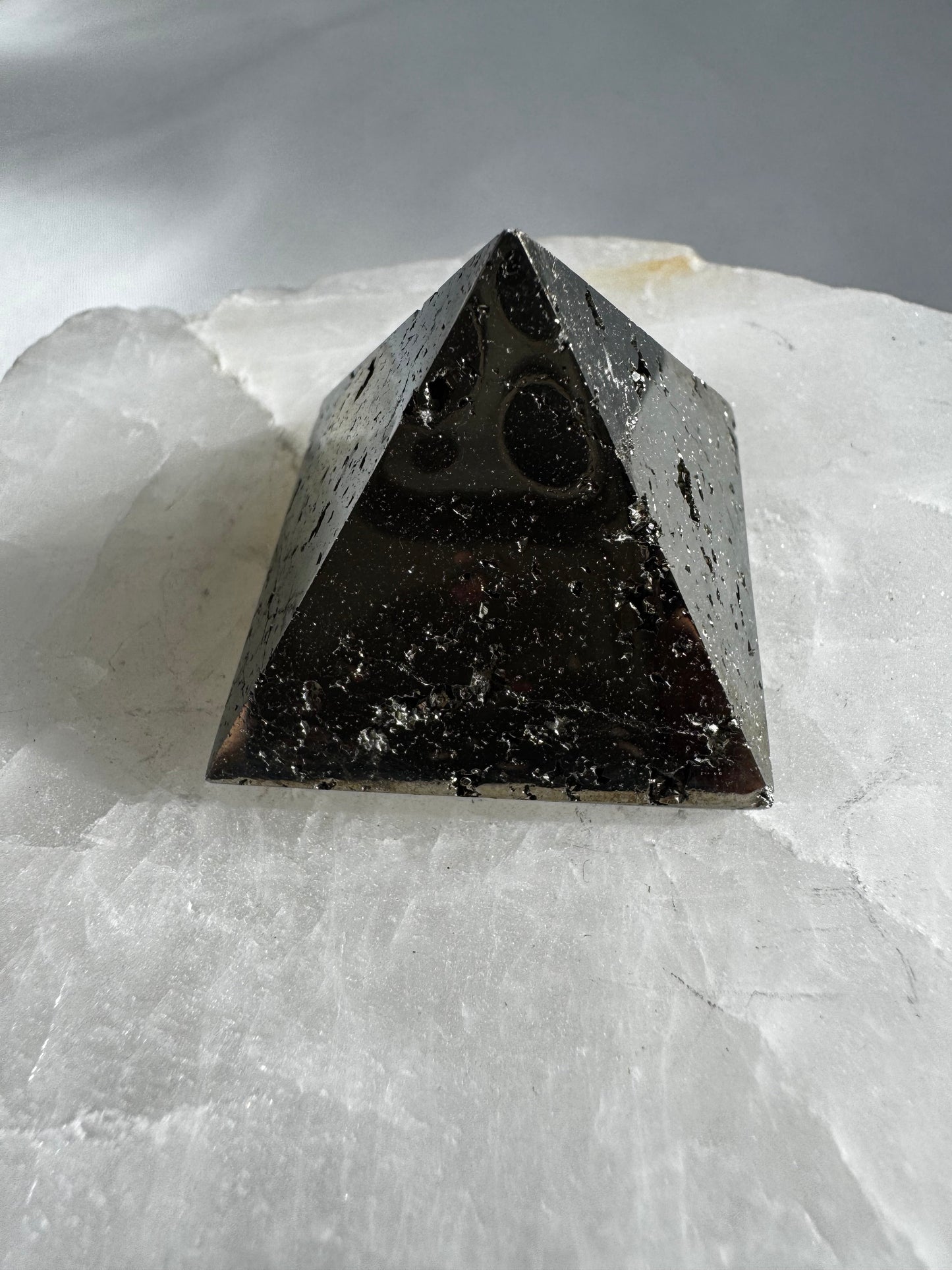 Polished Pyrite Pyramid #3 showcasing reflective surface and grounding energy, ideal for boosting confidence and wealth attraction.