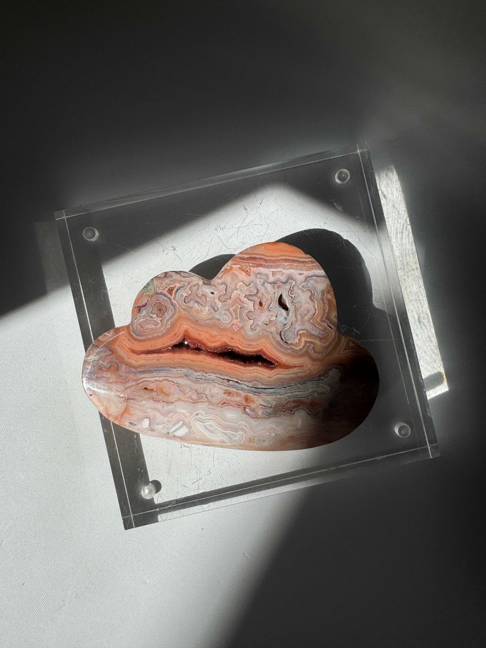Top view of Pink Lace Agate Crystal Cloud #2 on a clear acrylic base, showcasing vivid swirling patterns and natural druzy detail. Perfect for bespoke crystal decor | Online Crystal shops NZ