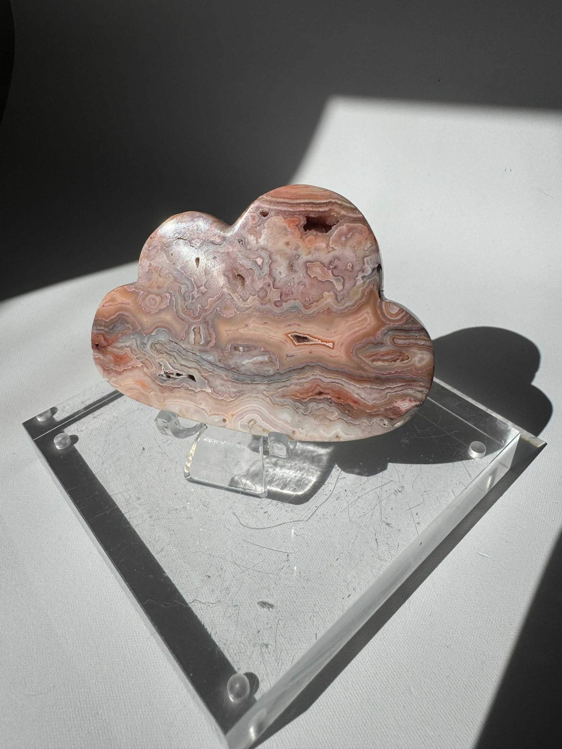 Pink Lace Agate Crystal Cloud #4 features swirling pink, cream, and brown patterns in a polished cloud shape. A rare collectible from Bespoke Crystals.
