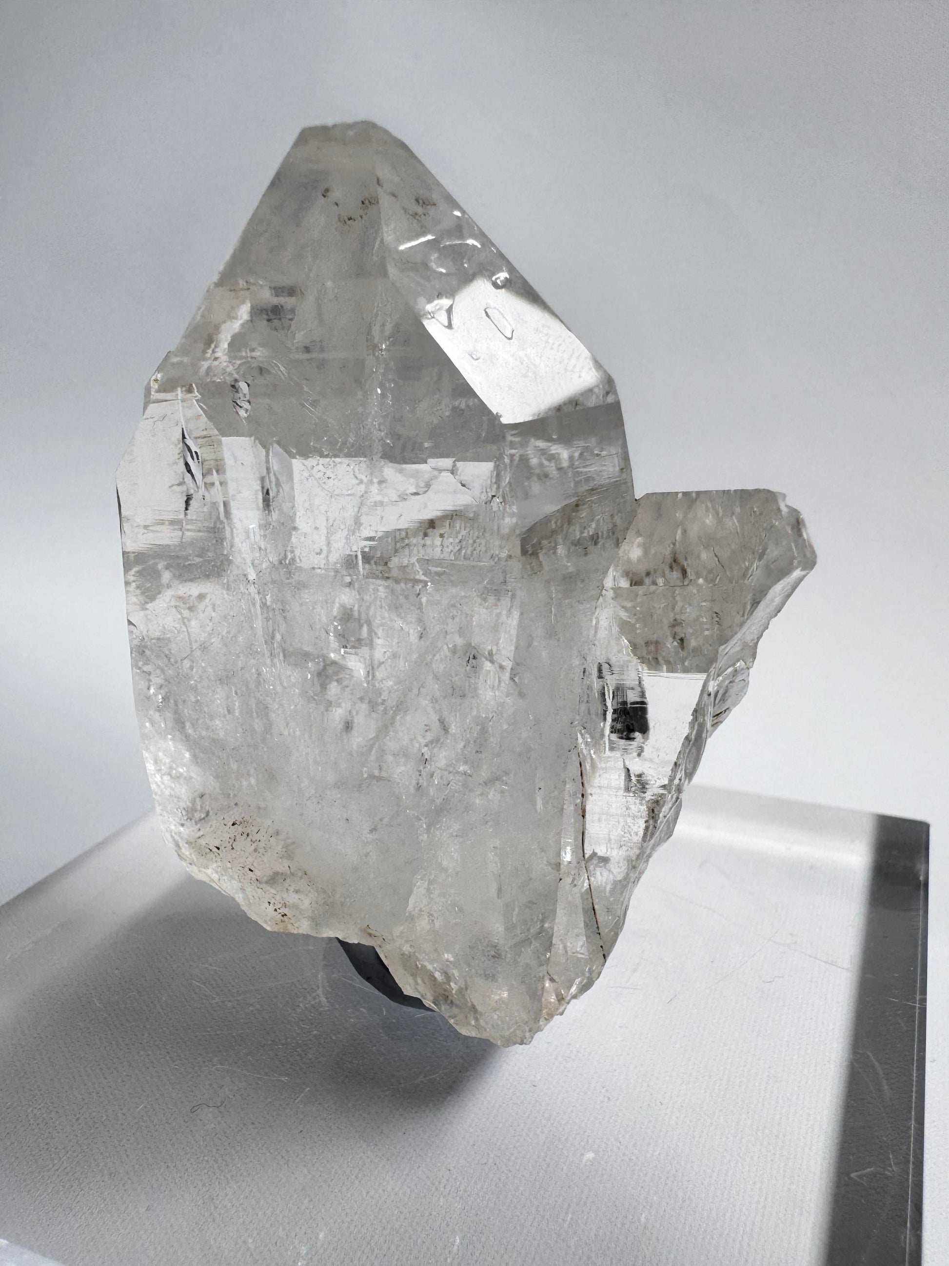 Side view of Silver Light Lemurian Seed Crystal #5 showing its prismatic structure and clarity. Premium Lemurian Quartz from Crystals NZ for collectors.