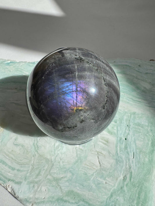 Labradorite Crystal Sphere #3 Bespoke Crystals featuring multicoloured flash on a textured green base, perfect for Crystal and mineral collections.