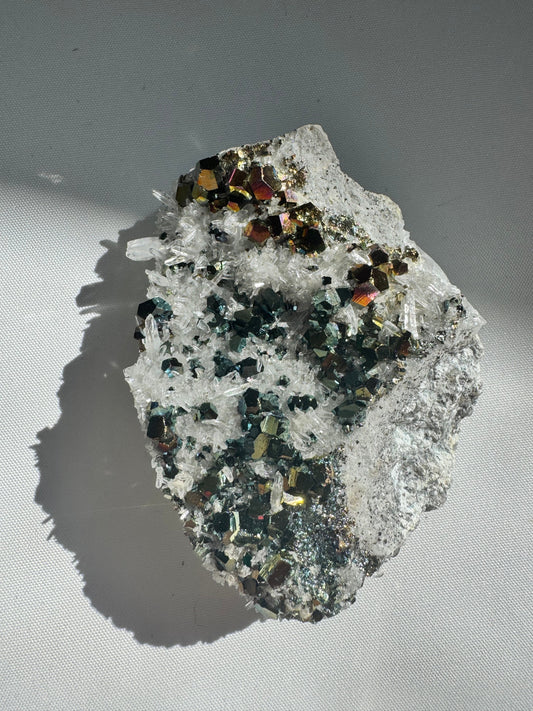 Iridescent Pyrite Crystal on Quartz #3 featuring vibrant rainbow pyrite cubes on clear quartz matrix, ideal for rare crystal collectors.