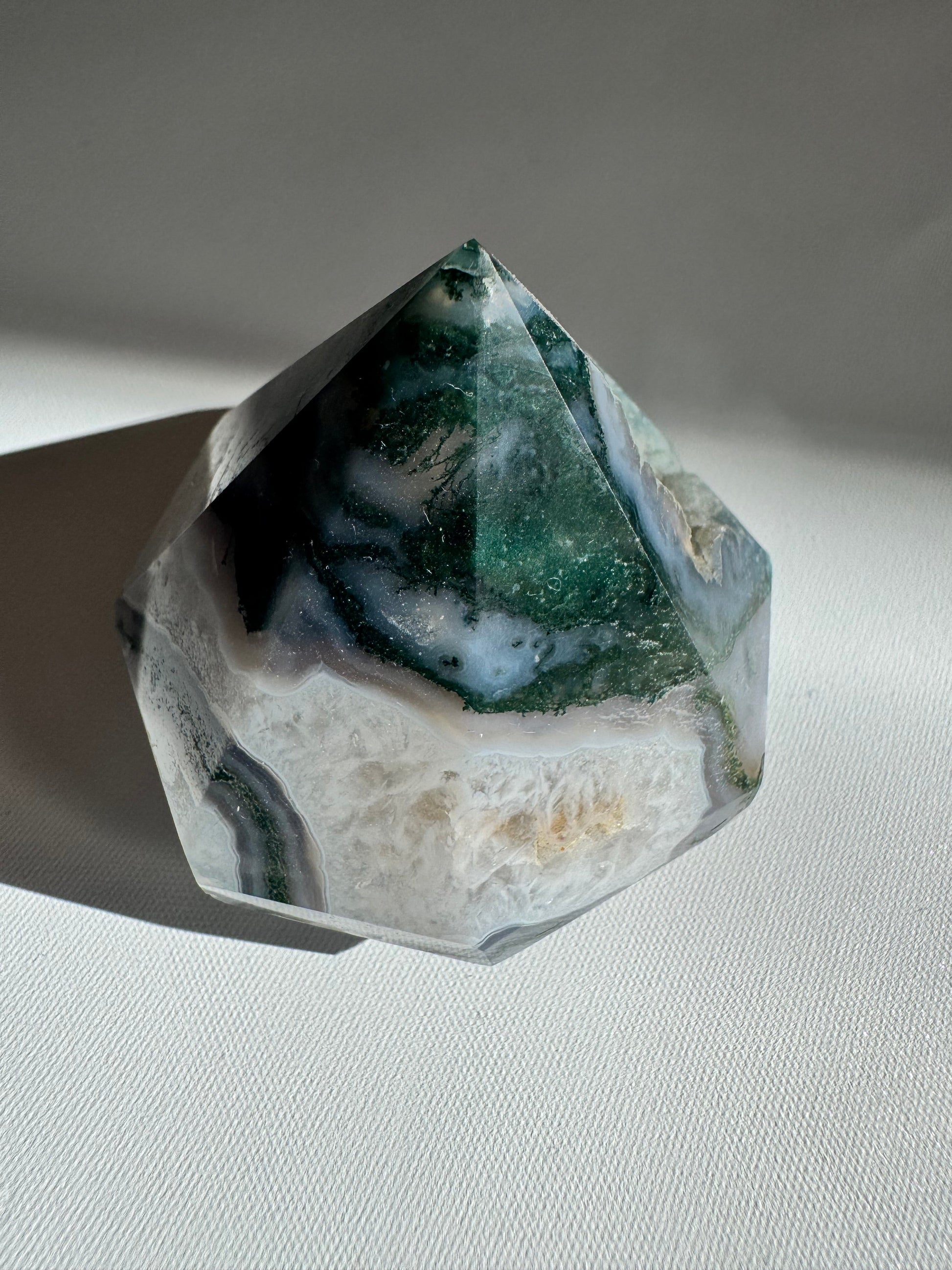 Faceted Moss Agate Crystal Diamond featuring deep green moss-like inclusions, a unique piece for your crystal collection
