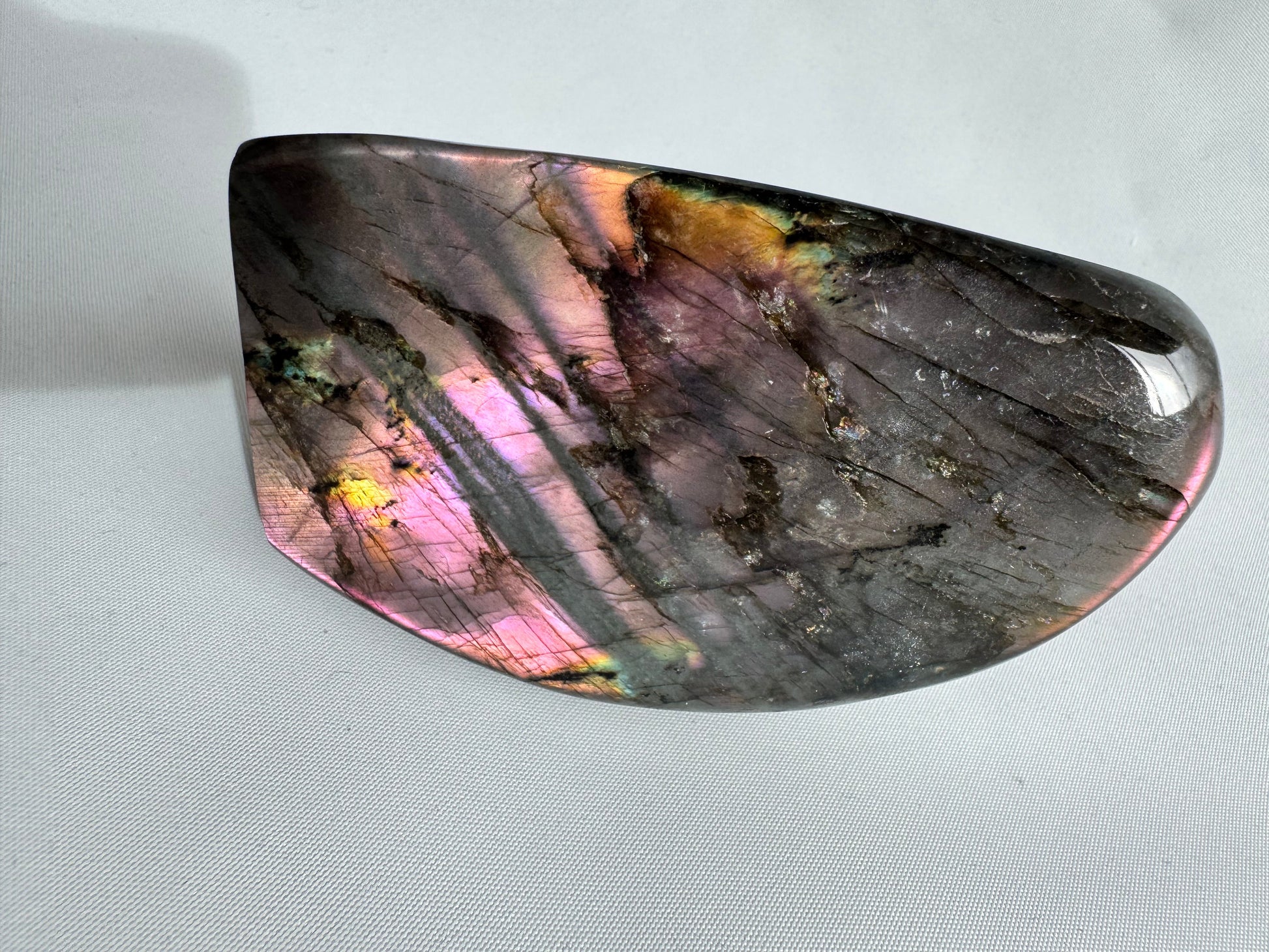 HQ Labradorite Freeform with vibrant iridescent flash in pinks, purple, gold, and orange hues, ideal for collectors and crystal enthusiasts.