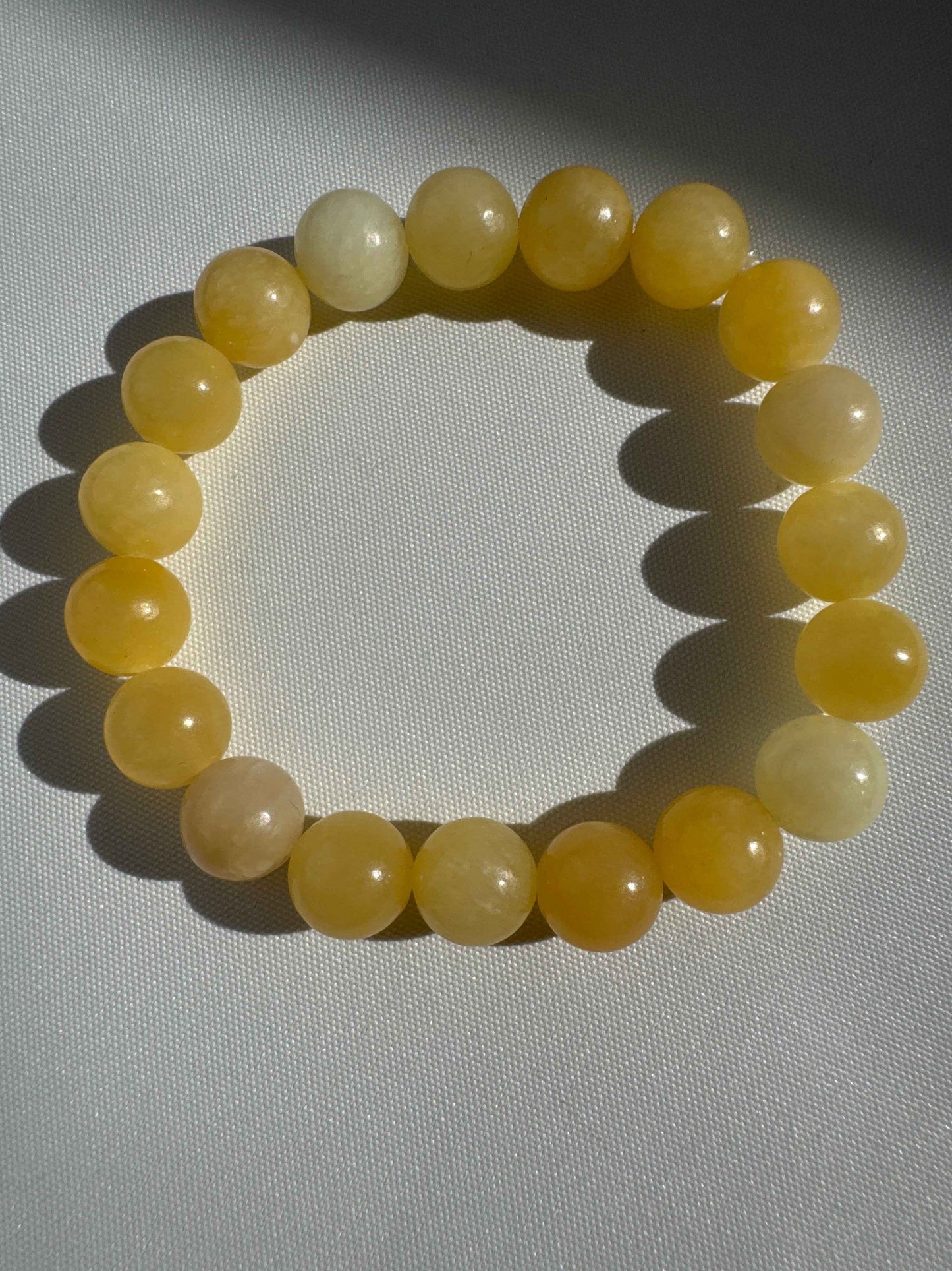 Honey Calcite Crystal Bracelet 10mm | polished golden beads 