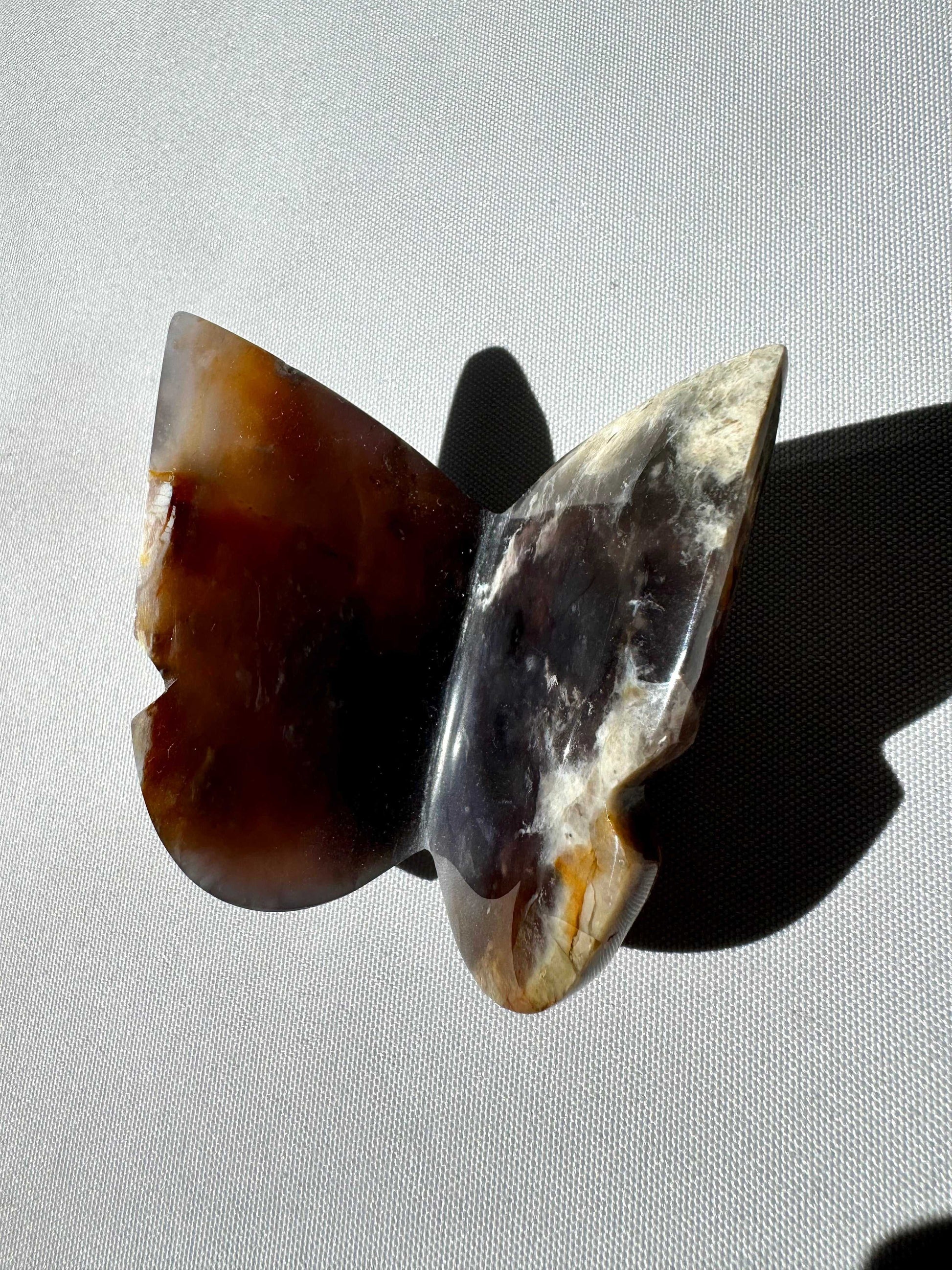 Top-down view of Purple Chalcedony Crystal 3D Butterfly highlighting its polished surface and unique mineral patterns, a rare collectible crystal carving | Bespoke Crystals
