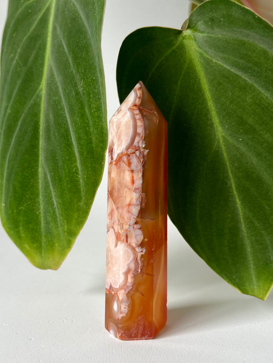 Flower Agate with Carnelian Point #6 | Crystals NZ tower featuring pink floral patterns and orange hues, ideal for emotional healing and creativity.