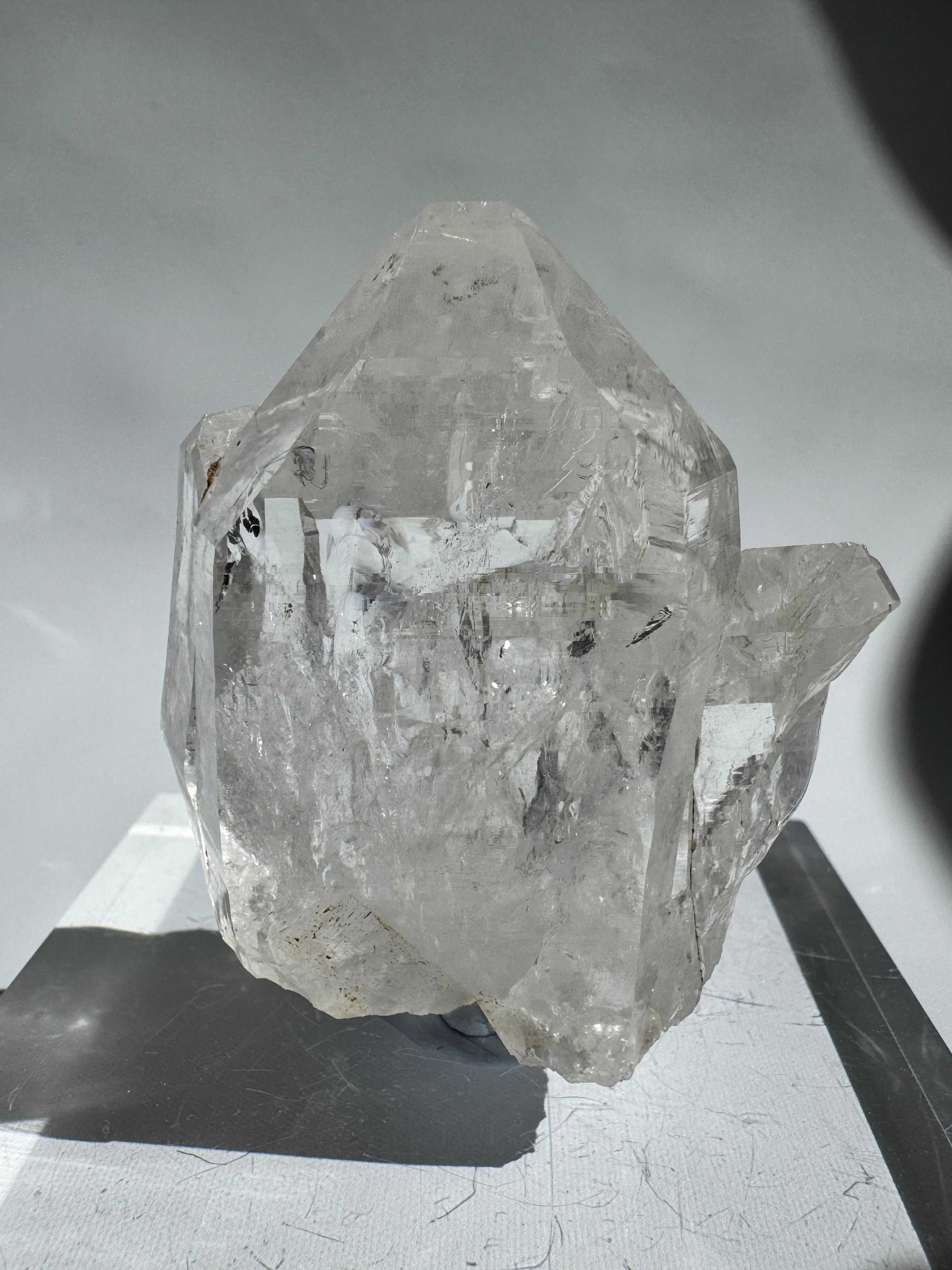 Front angle of Silver Light Lemurian Seed Crystal #5 highlighting its transparency and etched lines. Ethically sourced gemstone for higher consciousness.