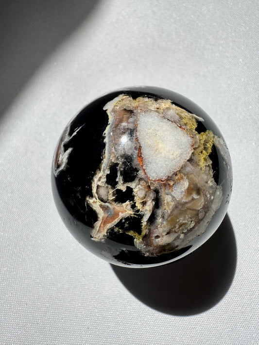 Black Flower Agate Sphere with white and earthy mineral inclusions, ideal for meditation and healing in rock and fossil collections | Crystals Online NZ