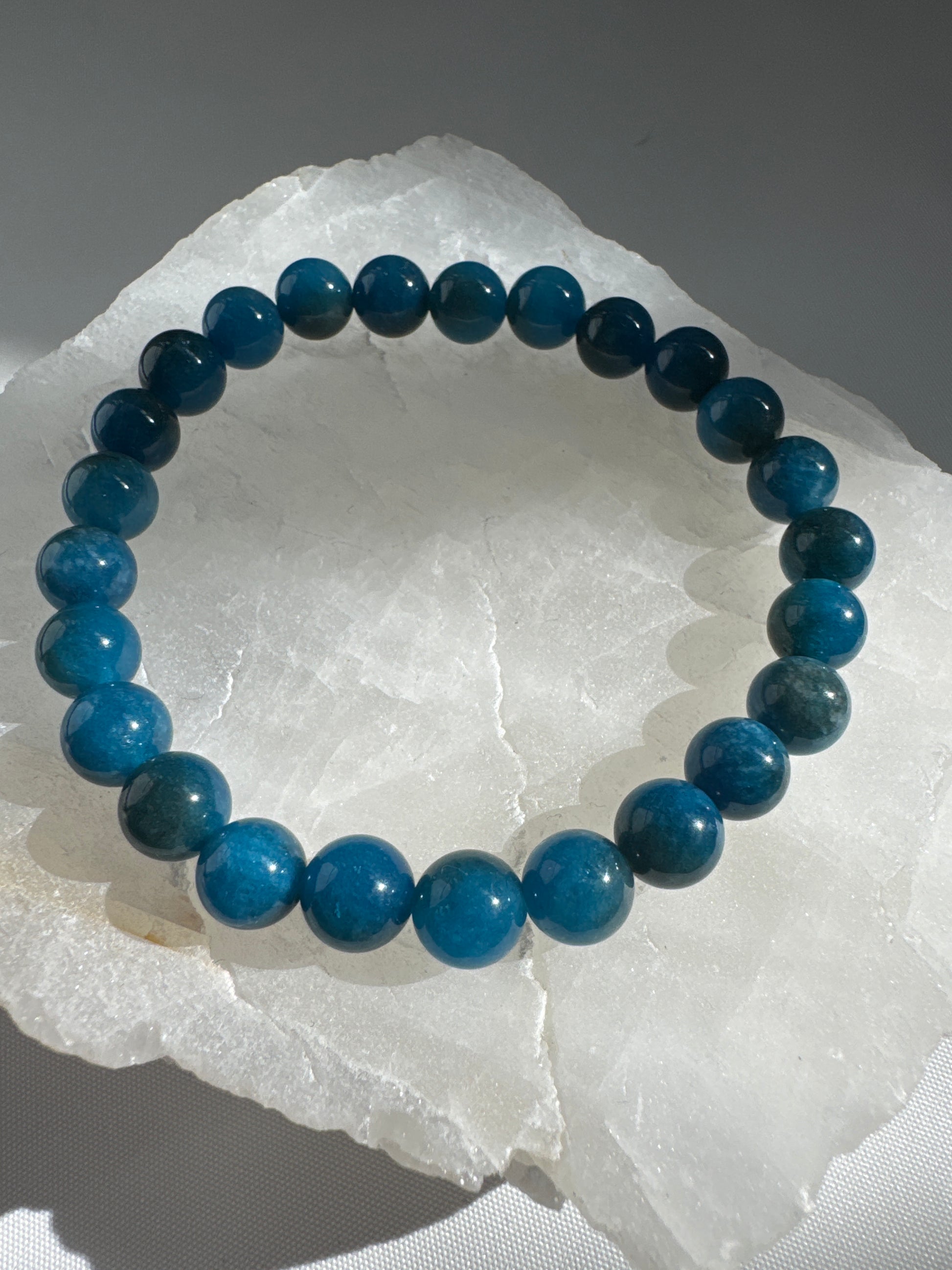 Blue Apatite Crystal Bracelet featuring bright blue beads 8mm | Bespoke Crystals 