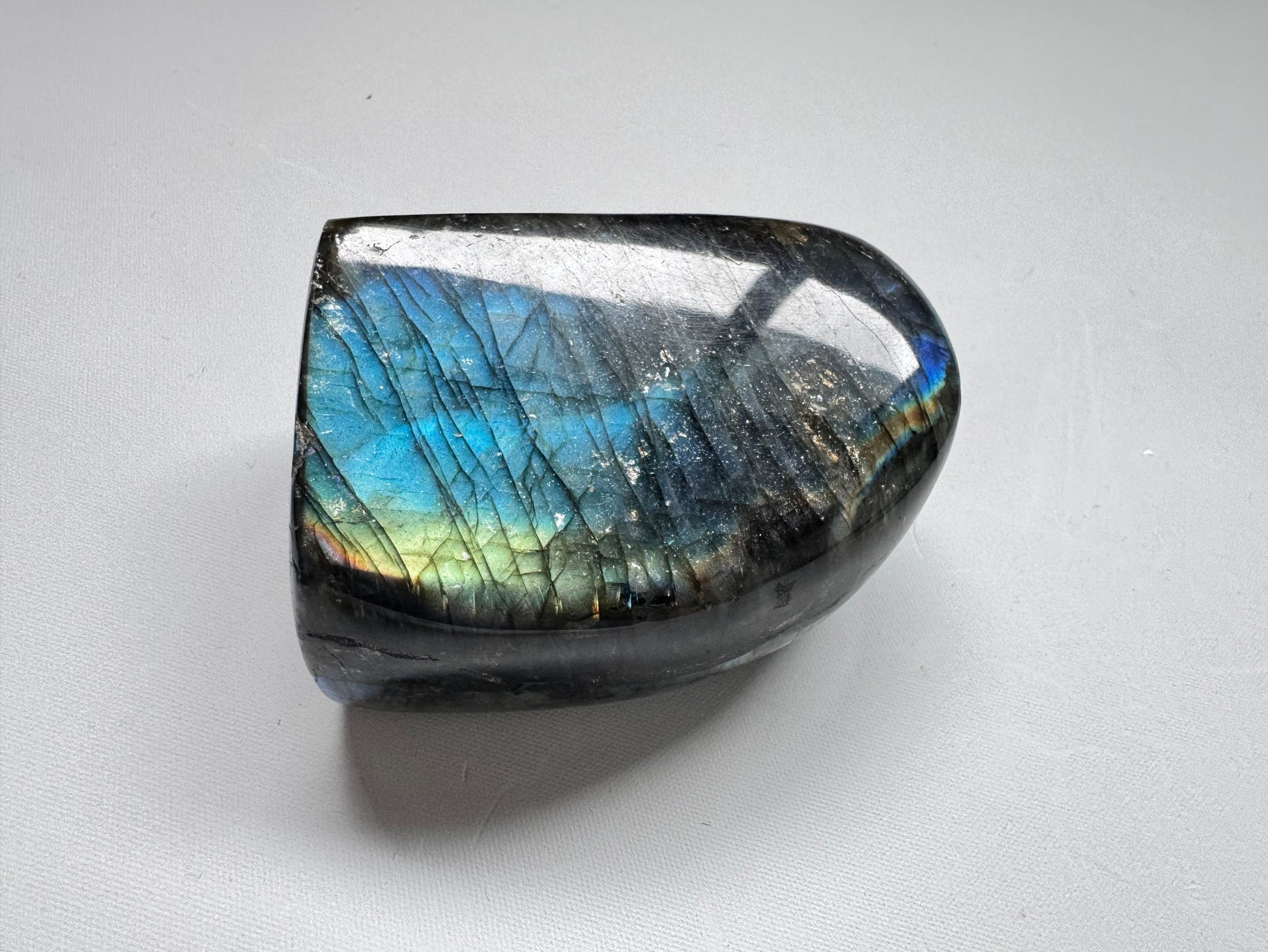 Polished HQ Labradorite Crystal Freeform A01 with iridescent blue and green hues, perfect for rock and fossil collectors or crystal healing enthusiasts.