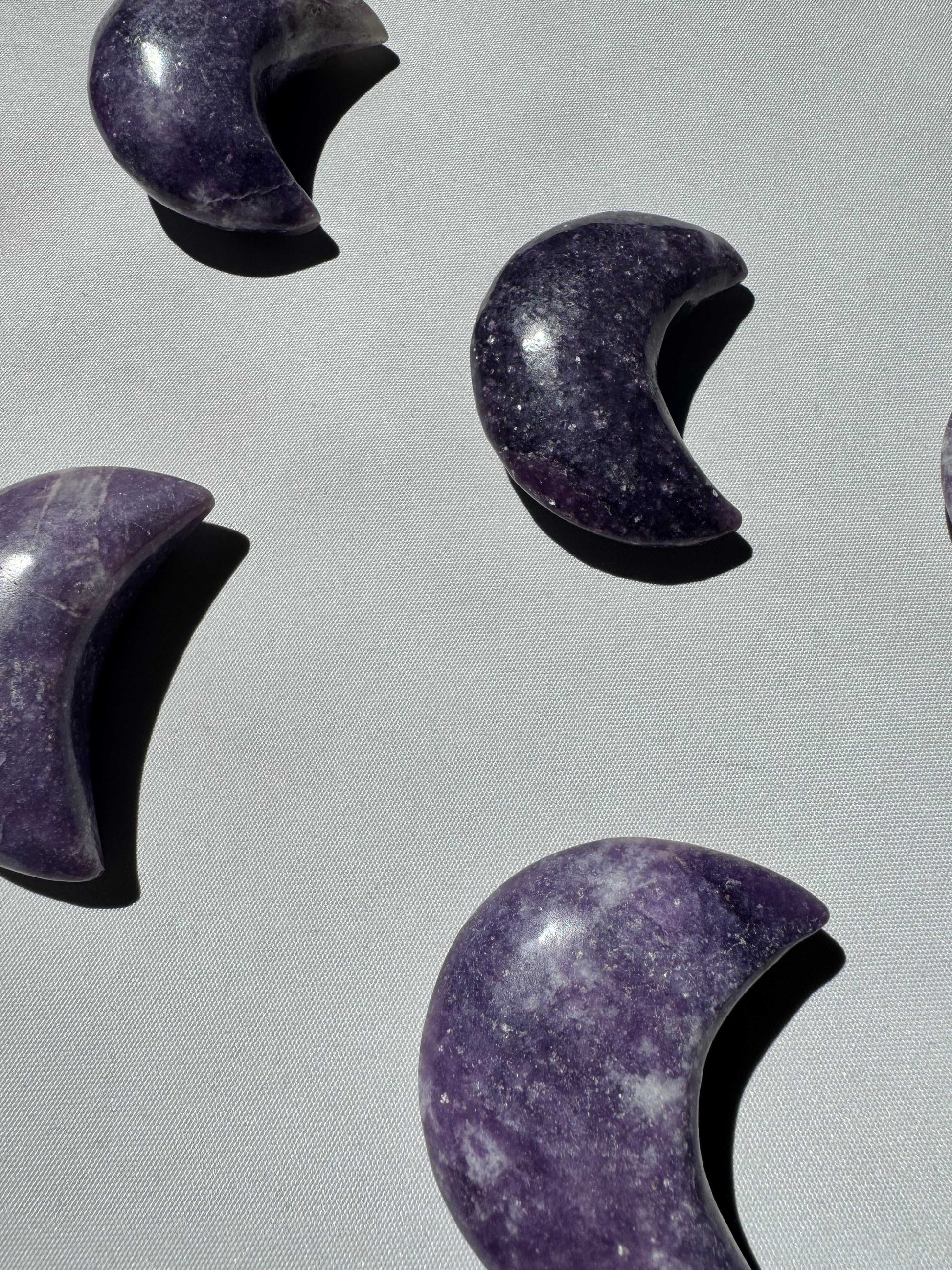 Lepidolite Crystal Moon carvings in crescent shapes | Bespoke Crystals