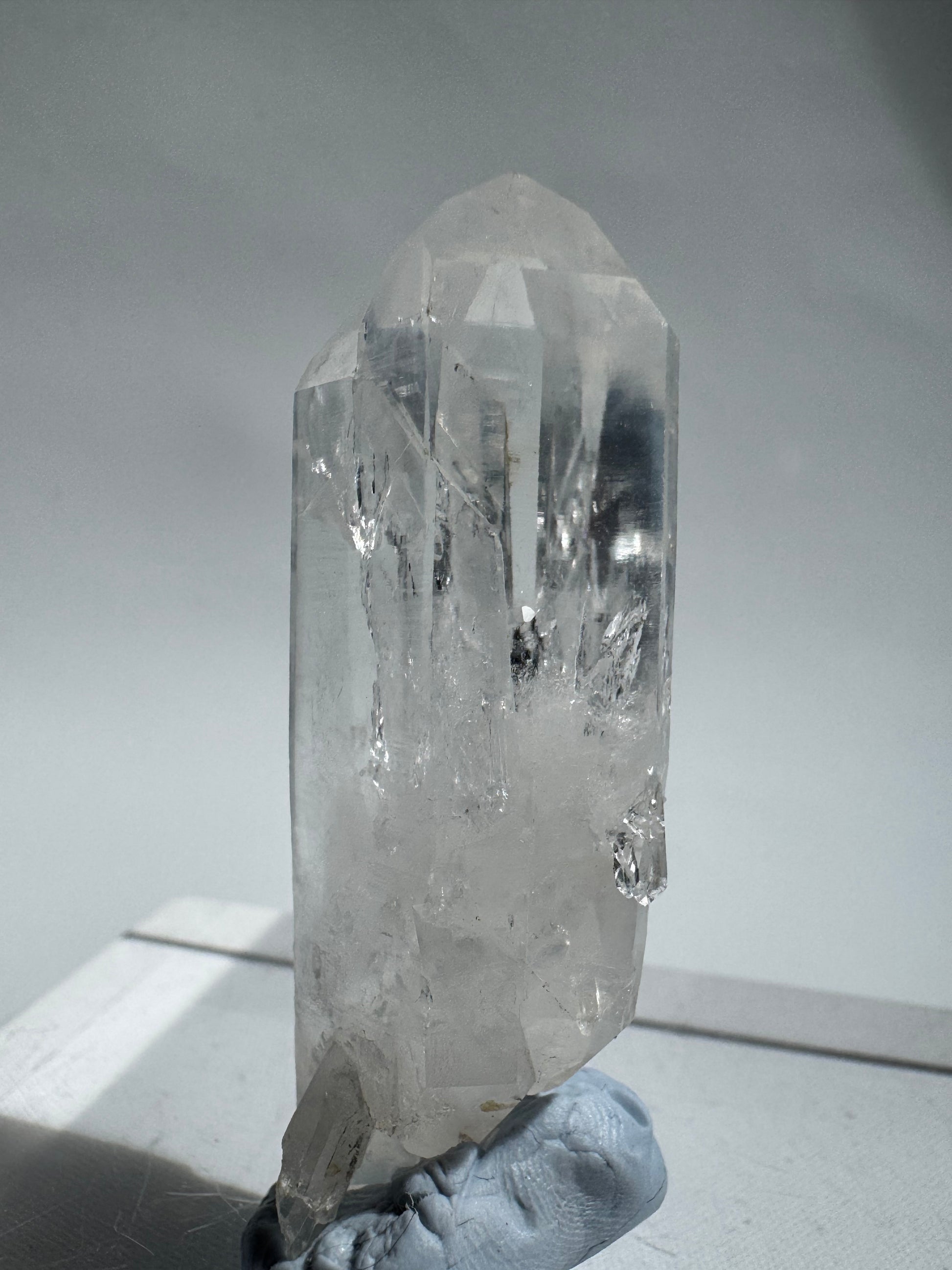 Ethically sourced Silver Light Lemurian Quartz Wand with visible Lemurian lines and twin crystal points, perfect for metaphysical use.