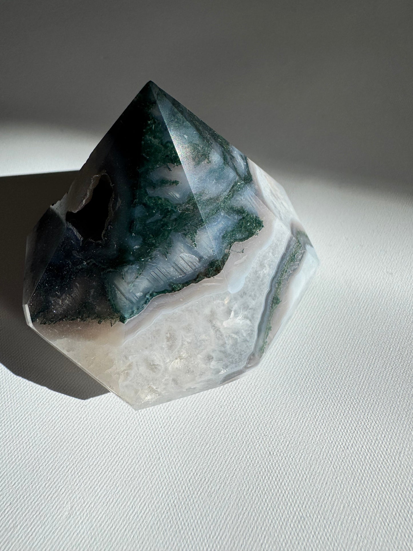 Polished Moss Agate Crystal Diamond showcasing layered green and white patterns, perfect for collectible crystal carvings and decor.