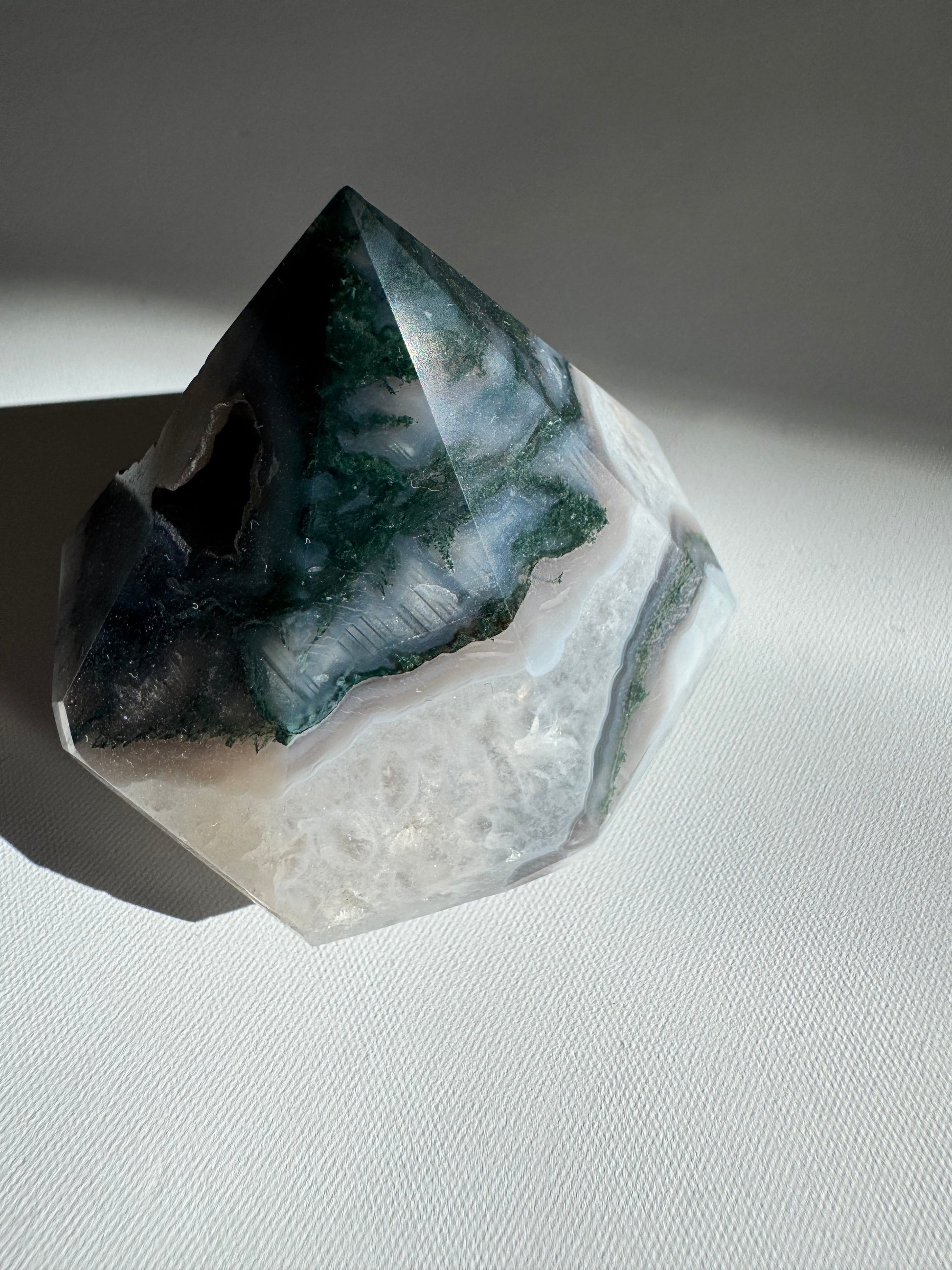 Polished Moss Agate Crystal Diamond showcasing layered green and white patterns, perfect for collectible crystal carvings and decor.