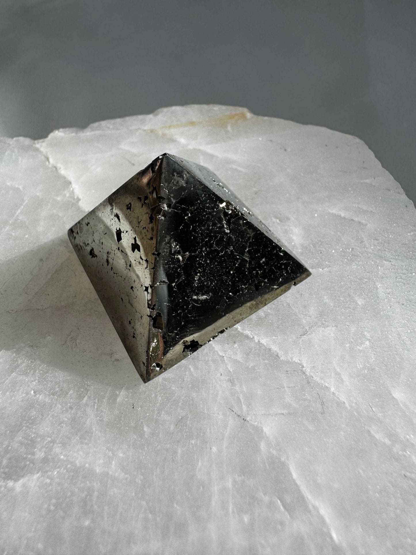 Polished Pyrite Pyramid #2 featuring grounding textures and reflective surfaces, ideal for boosting confidence and energy in any space.
