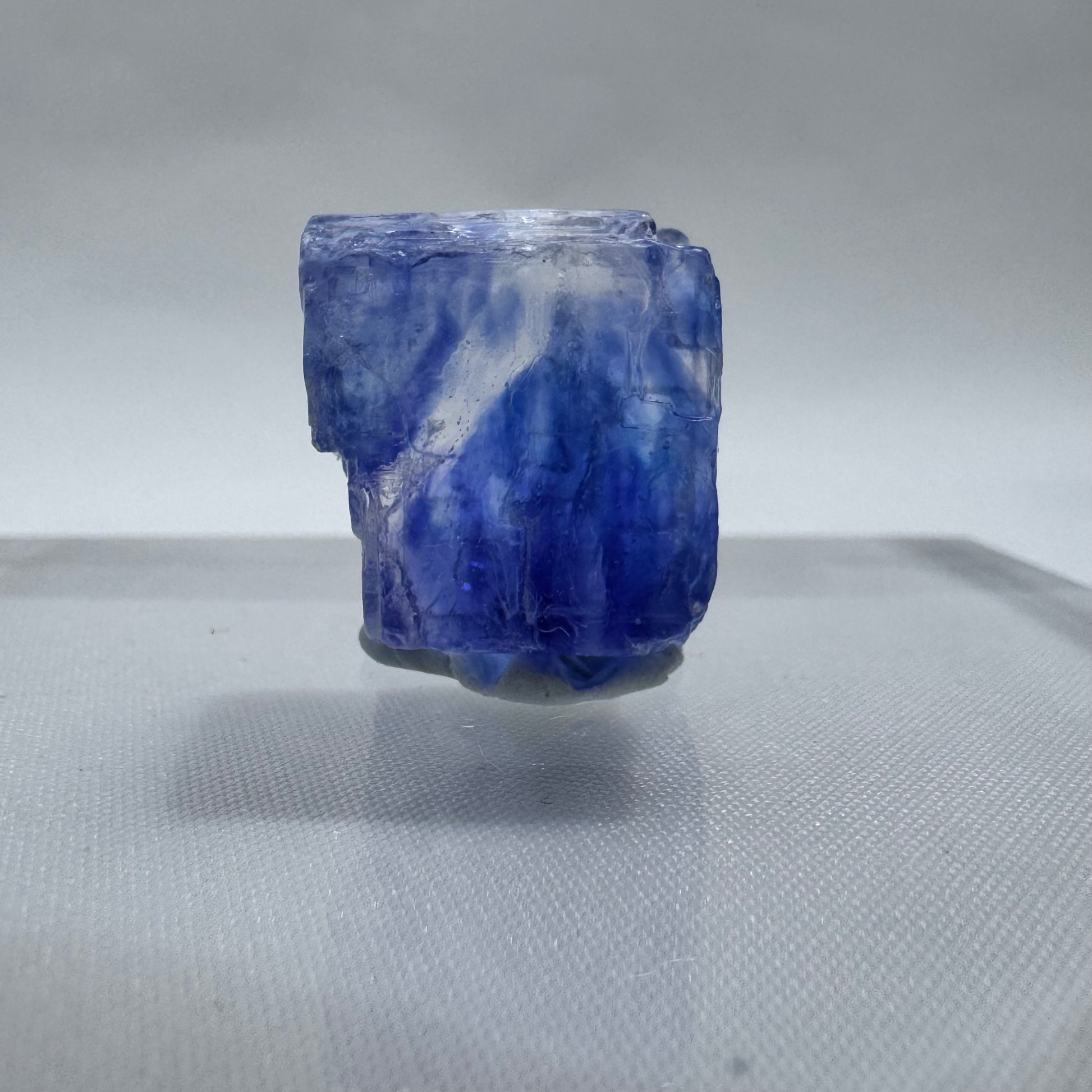 Small Blue Halite cube with intense blue saturation and natural surface texture, ideal for metaphysical or geological collections.