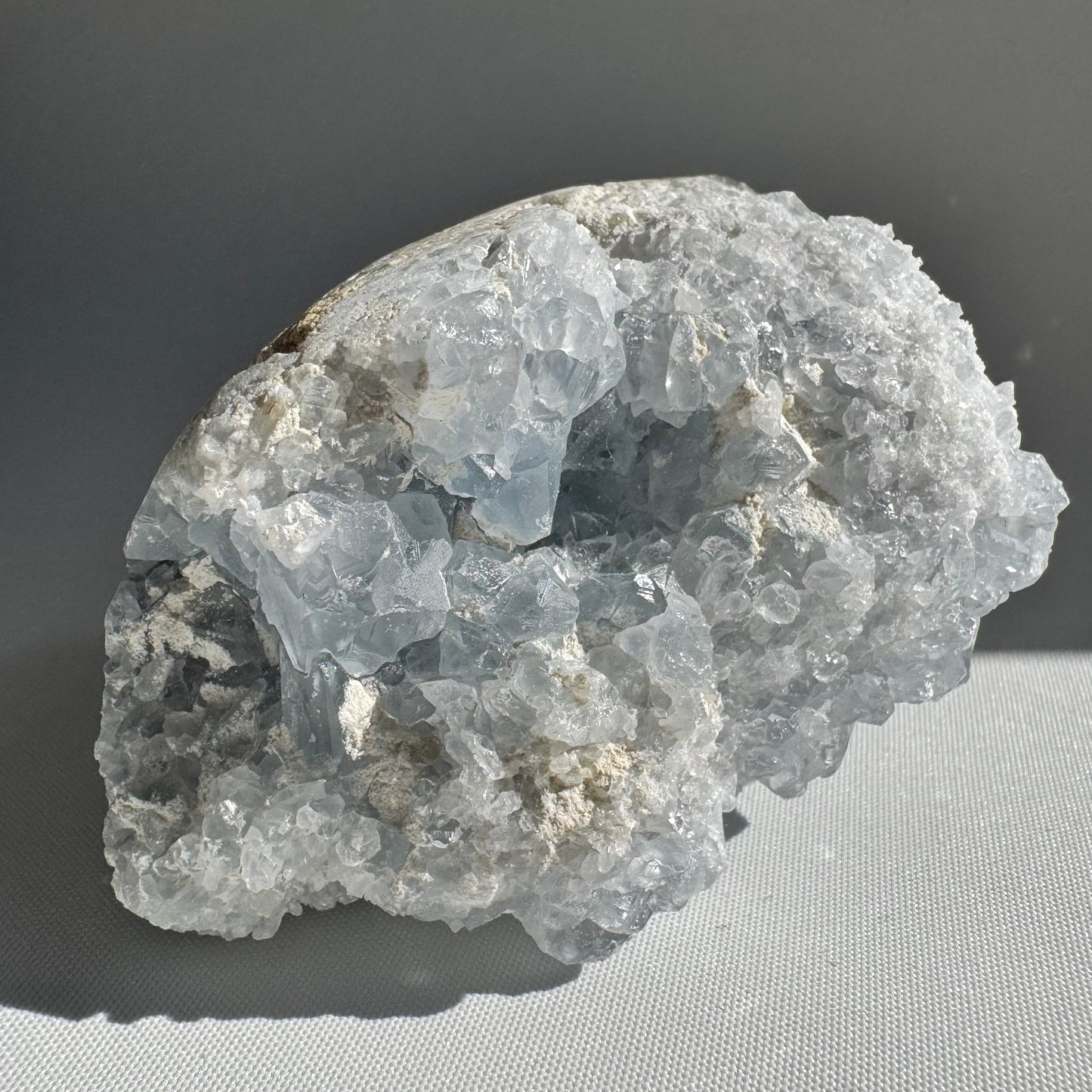 Celestite Crystal Druze Cluster #1 with sparkling pale blue formations, perfect for rock collectors and spiritual decor in New Zealand.