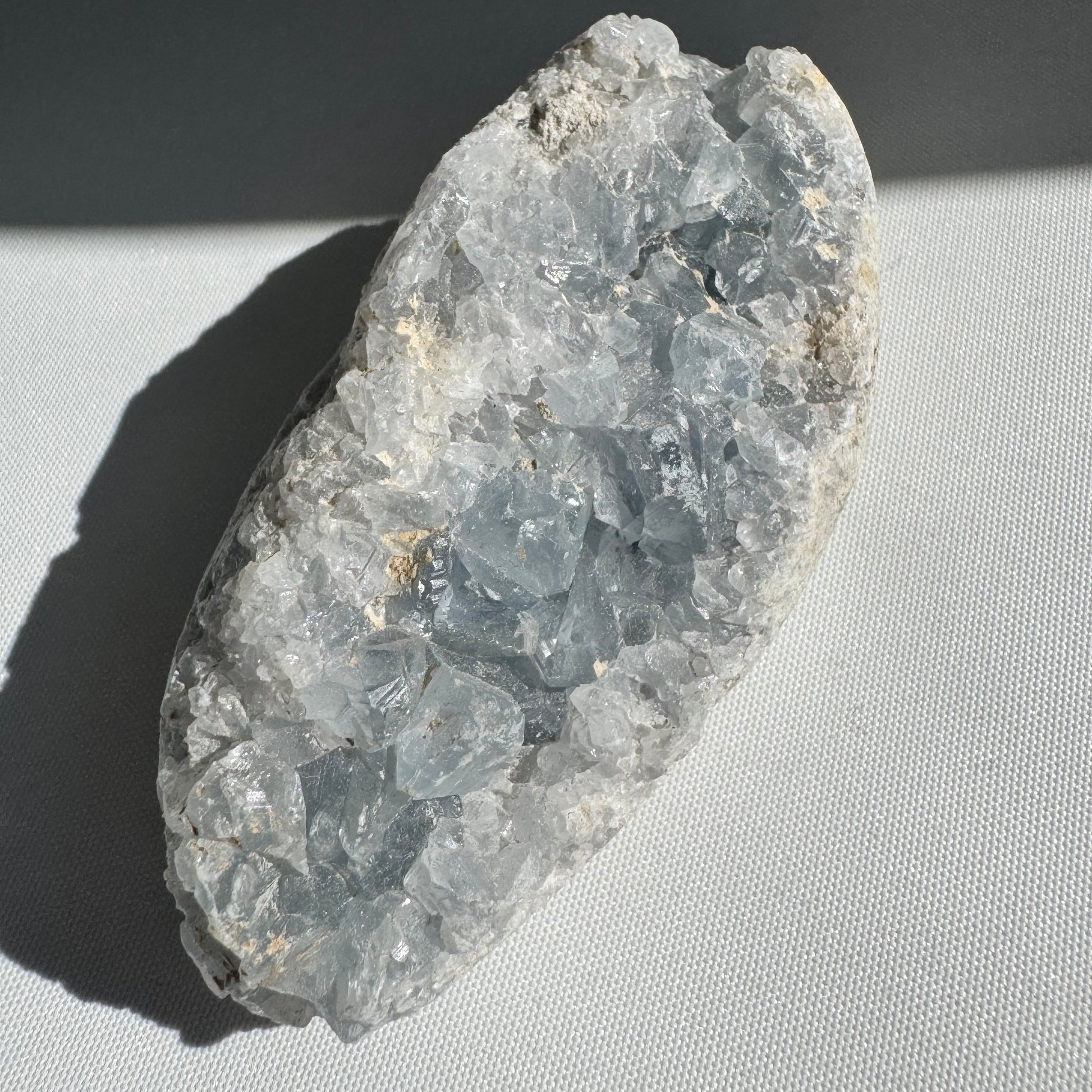 Celestite Cluster #4 with shimmering blue druzy crystals, ideal for peace and wisdom. A unique collectible rock from Crystals NZ.
