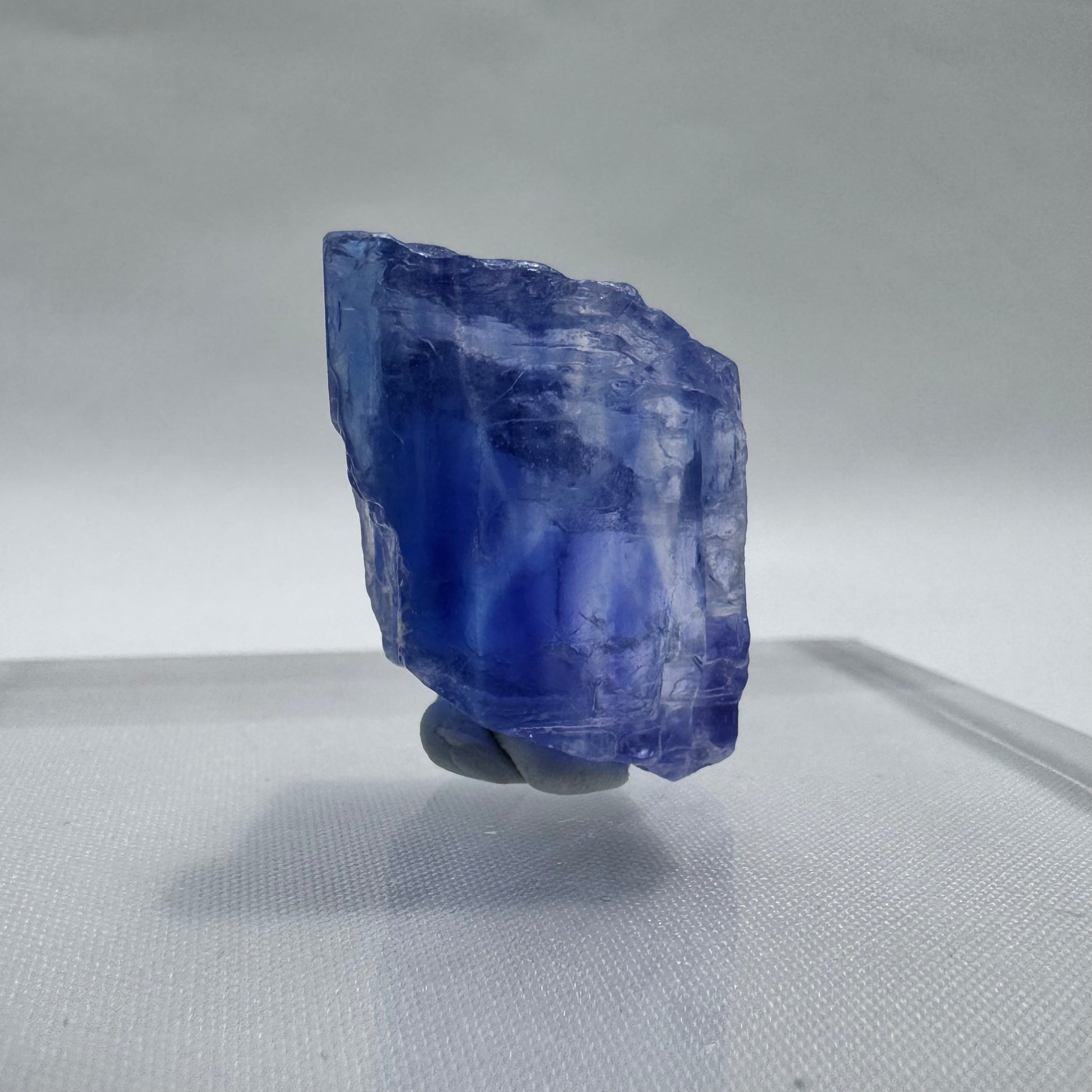 Compact Blue Halite Specimen with translucent blue layers, perfect for display or use in chakra alignment practices.