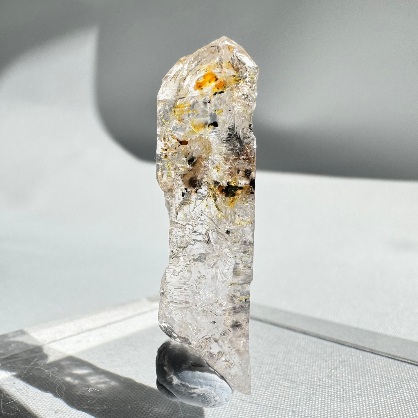 UV Reactive Firefly Enhydro Quartz with visible petroleum inclusions, part of Quartz Petroleum Enhydros gemstone collectibles.