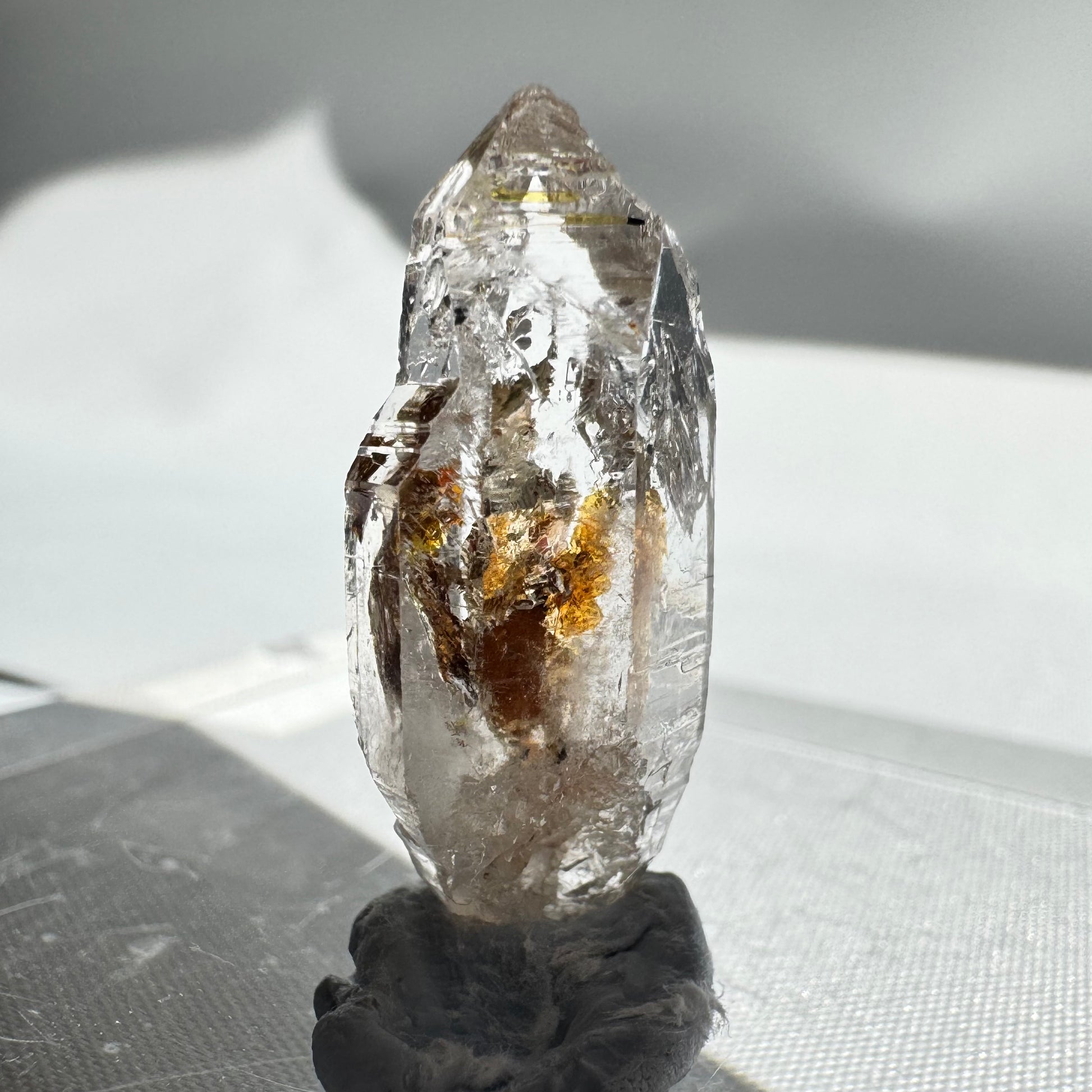 Unique UV Reactive Firefly Enhydro Quartz with fiery internal patterns, part of the Enhydros Quartz collectible series.