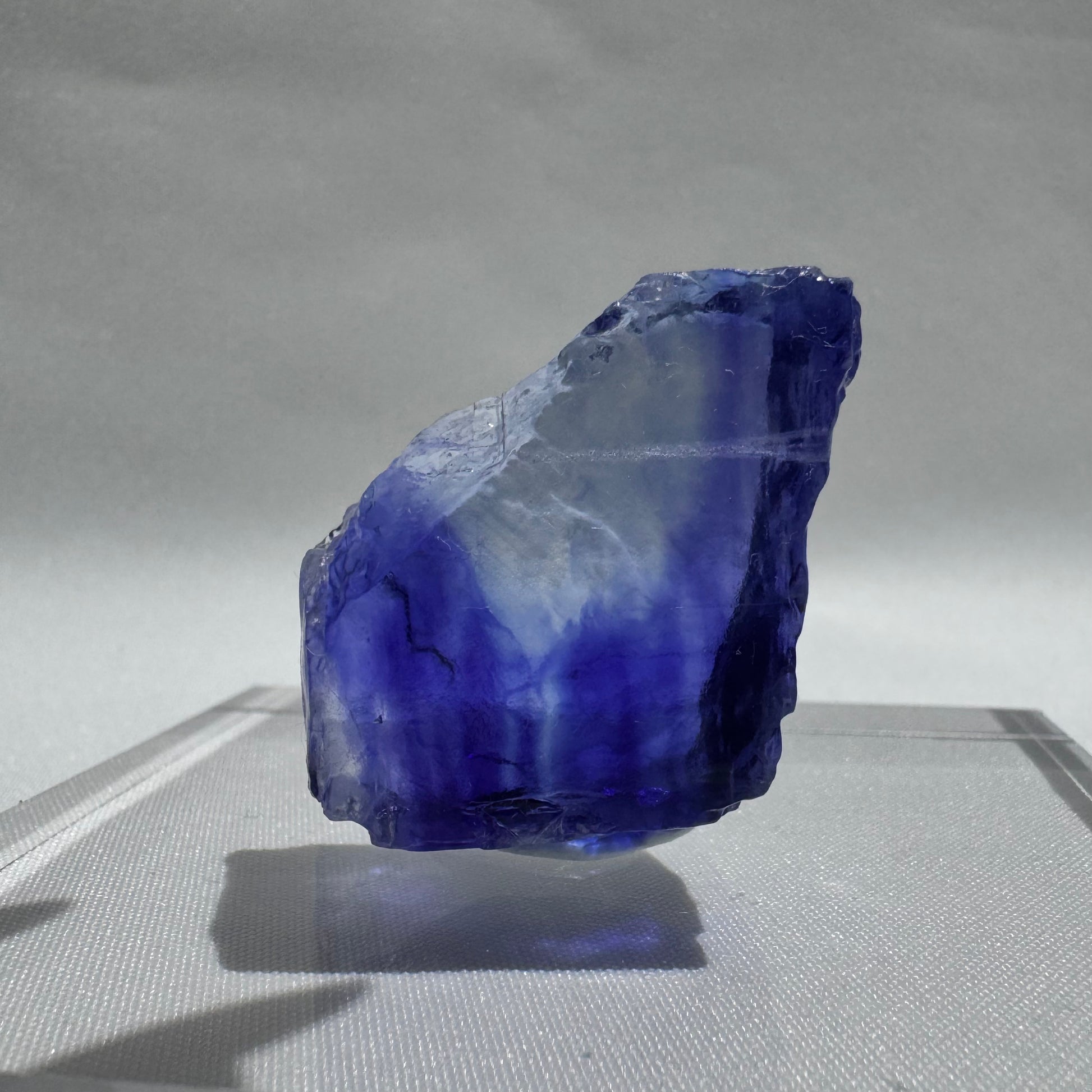 Striking Blue Halite crystal with a gradient of deep to light blue, showcasing natural clarity and raw mineral texture.