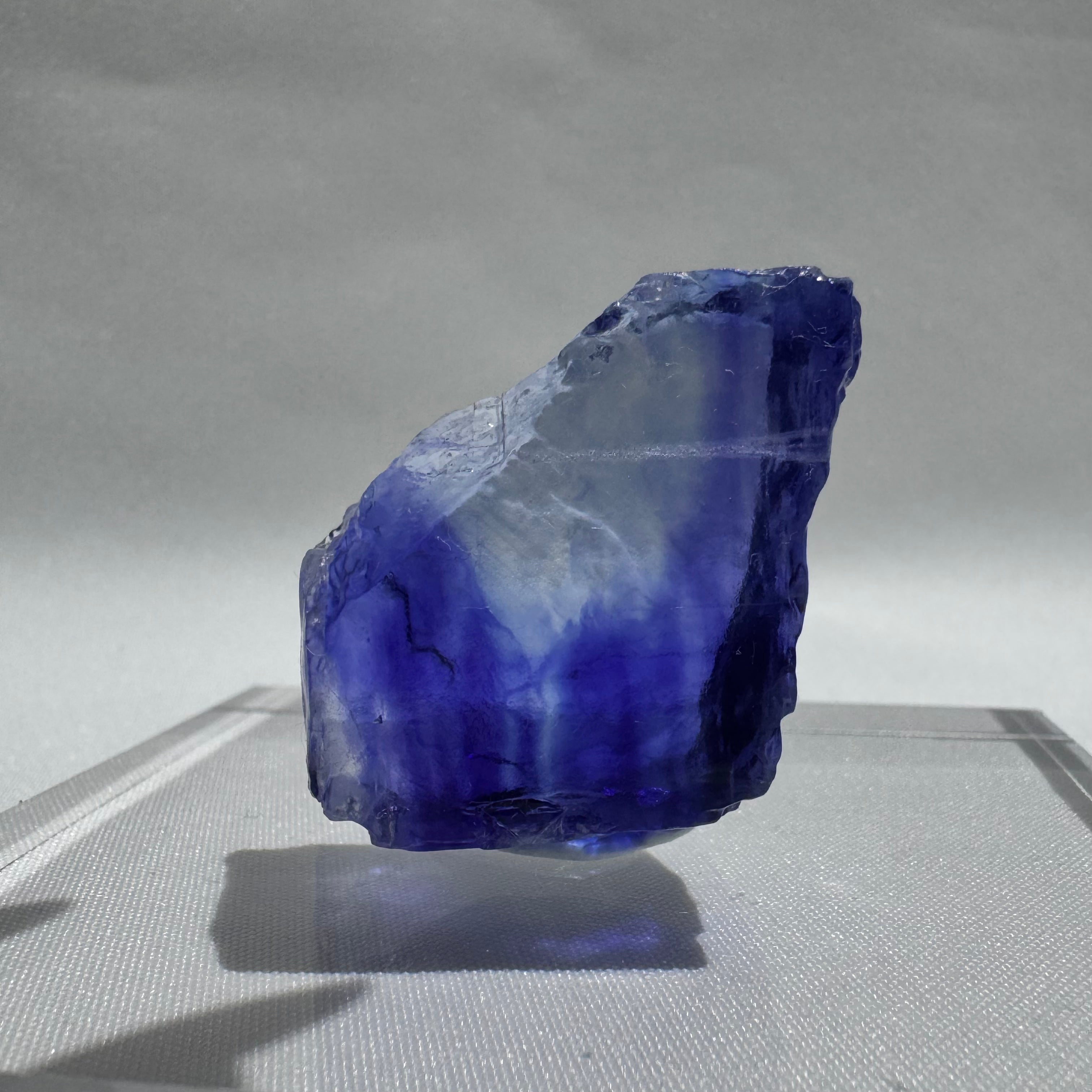 Striking Blue Halite crystal with a gradient of deep to light blue, showcasing natural clarity and raw mineral texture.