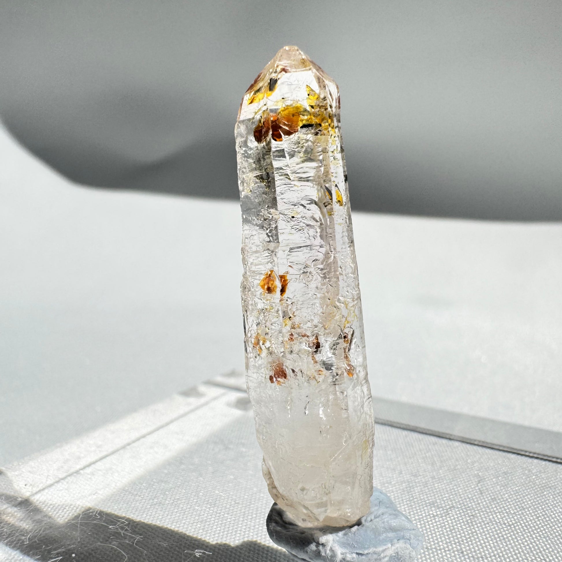 Tall UV Reactive Firefly Enhydro Quartz with internal liquid inclusions, a rare petroleum quartz for rock and fossil collections.