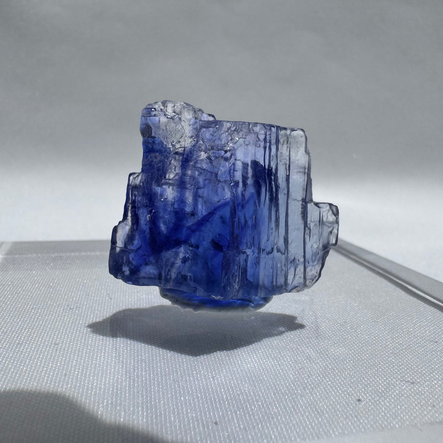 Irregular Blue Halite crystal with vertical striations and neon blue coloration, ideal for collectors of rare natural minerals.
