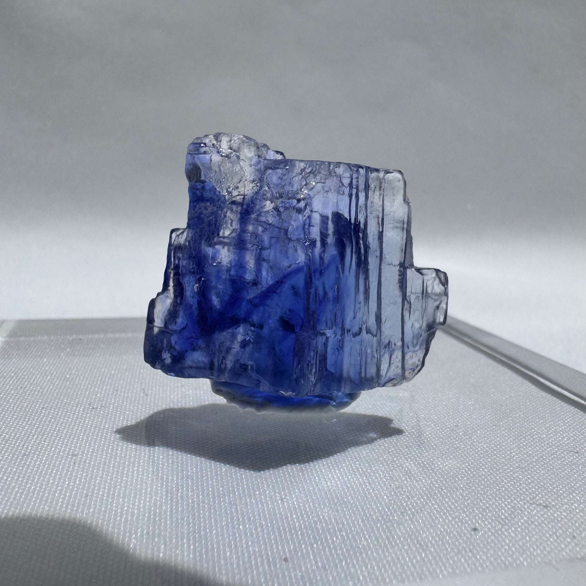 Irregular Blue Halite crystal with vertical striations and neon blue coloration, ideal for collectors of rare natural minerals.