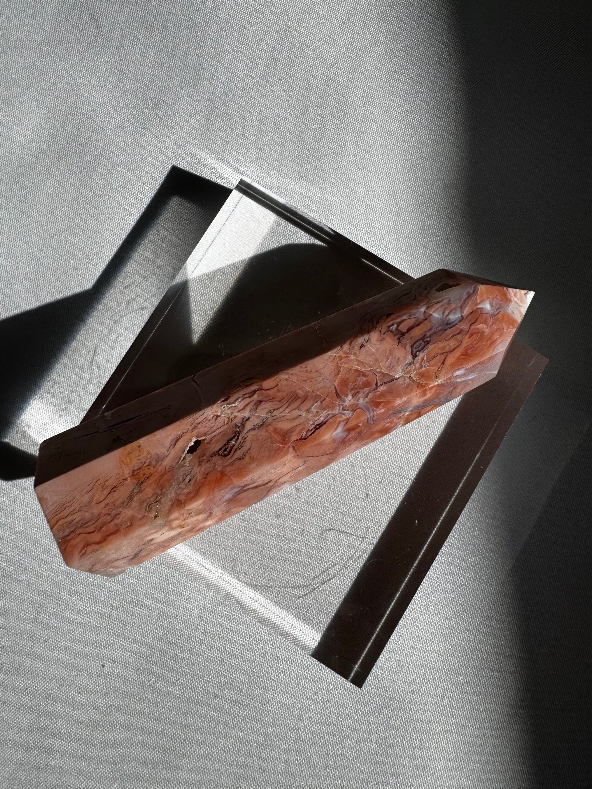 Horizontal angle of Cotton Candy Agate Crystal Point #1 highlighting intricate marbling and polished finish, perfect for decorative crystal displays.