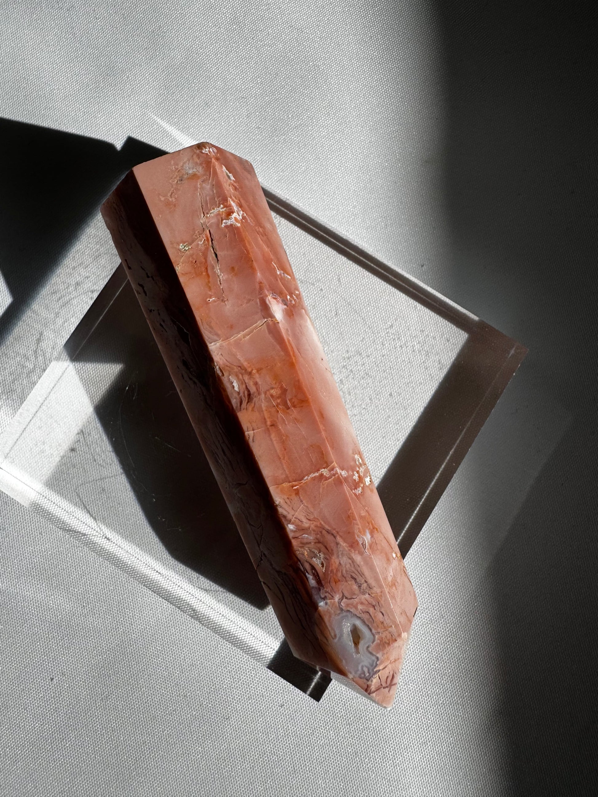 Side view of Cotton Candy Agate Crystal Point #1 showing deep peach tones and natural veining, ideal for crystal collectors and enthusiasts.