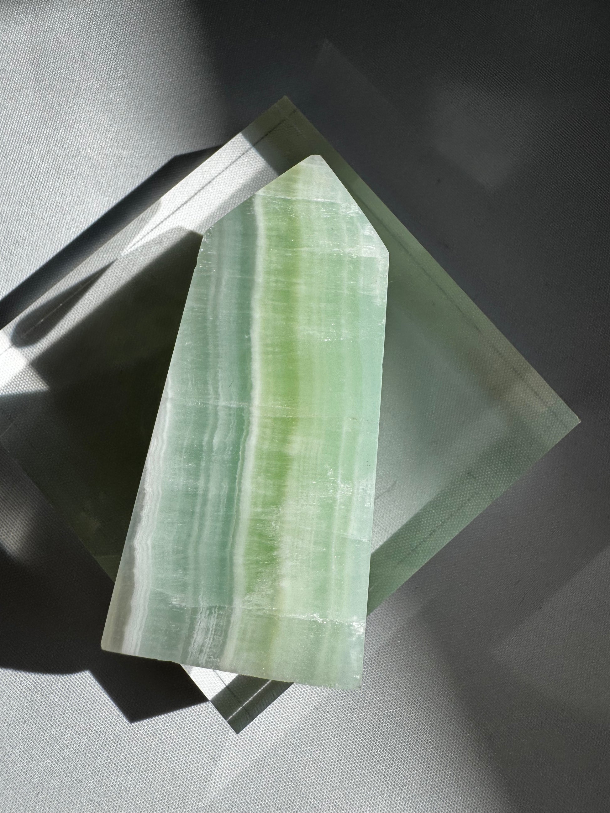 Polished Pistachio Calcite Mini Tower #3 featuring calming green tones and natural banding, ideal for healing and transformation rituals.