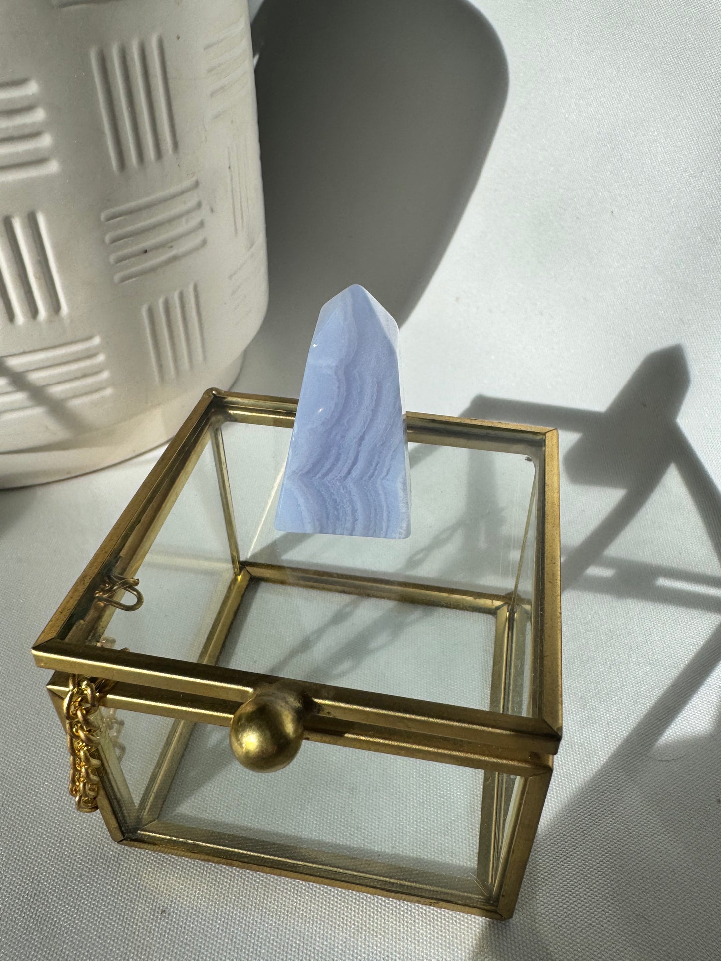 Close-up of Blue Lace Agate Mini Tower with delicate blue and white bands