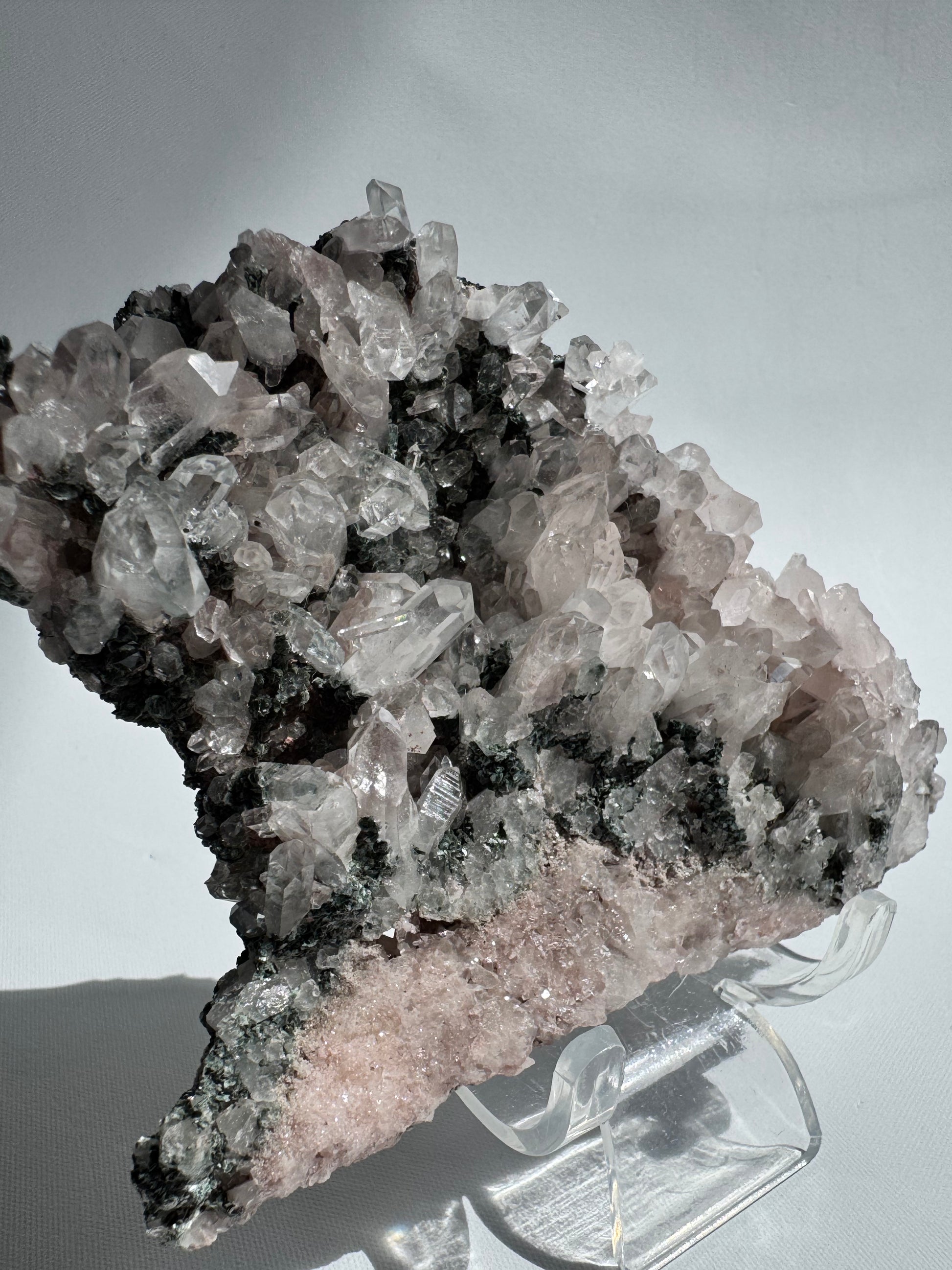 Healing Pink Lithium Lemurian Seed Quartz Cluster featuring sparkling points and grounding green hues, perfect for emotional balance rituals.
