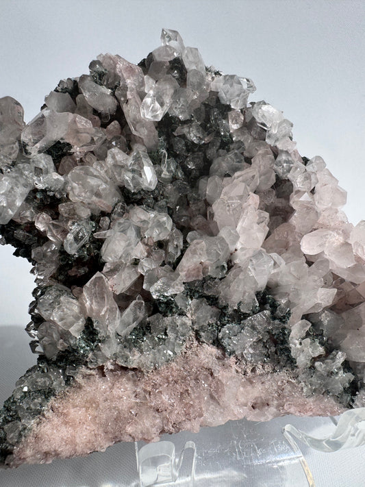 Pink Lithium Quartz Cluster with clear Lemurian points and green mineral inclusions, ideal for healing crystal collectors in NZ.