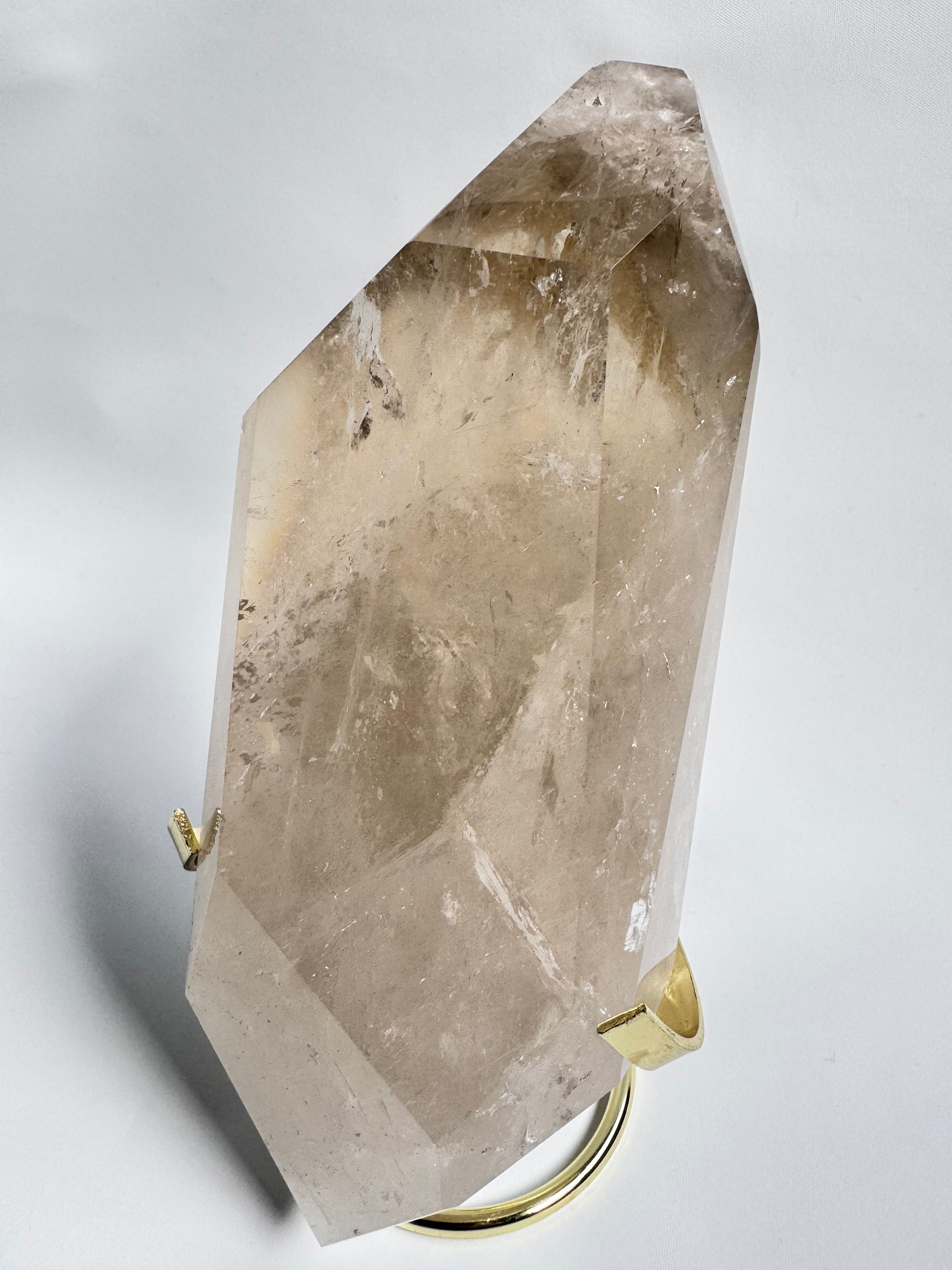 Natural Citrine Crystal - Abundance & Joy | Crystals NZ shown at an angle, highlighting its polished surface and radiant amber hues.