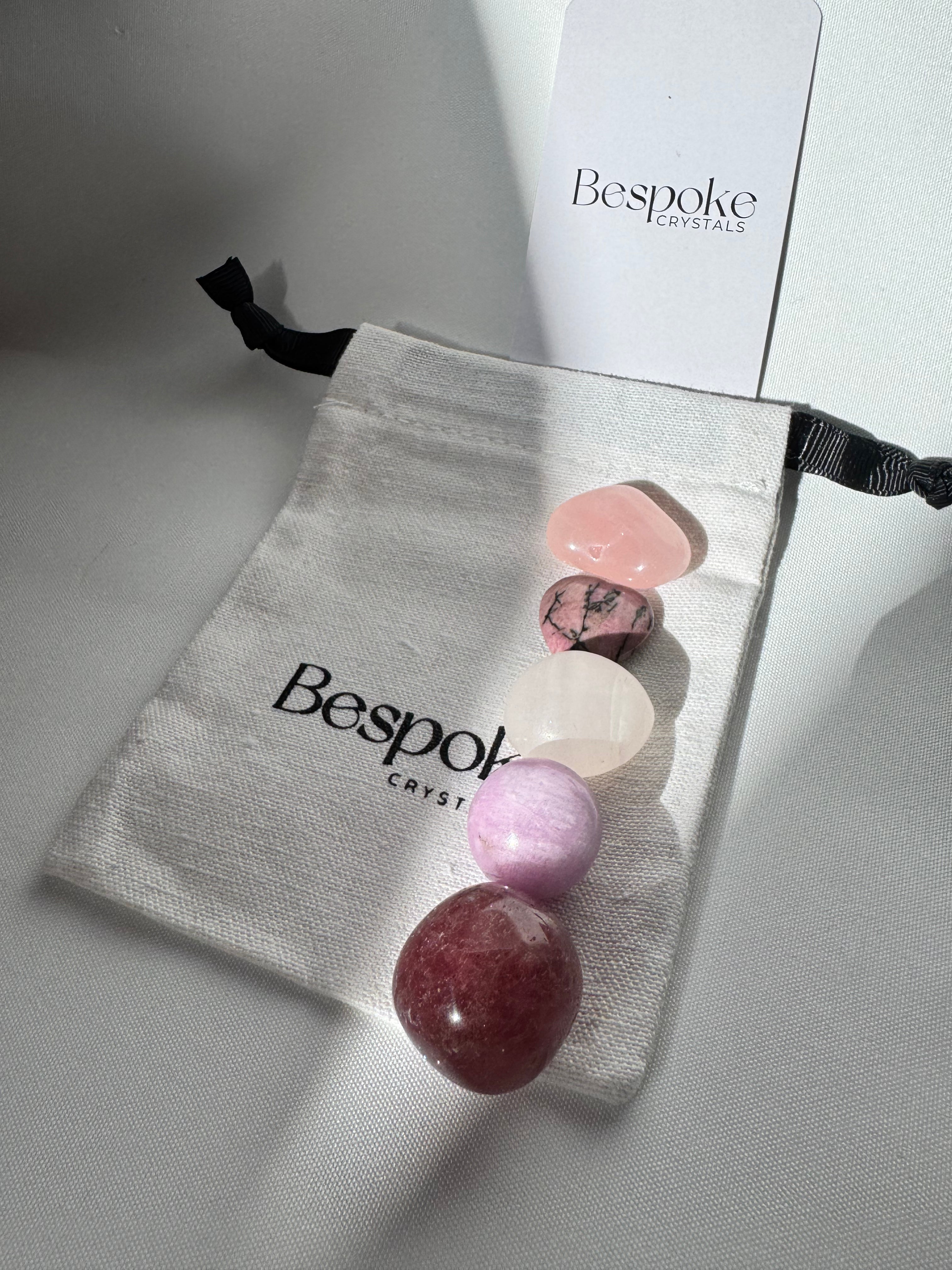 Self Love Crystals Kit - Bespoke Healing includes five polished stones like Rose Quartz and Rhodonite on a branded pouch for emotional balance.