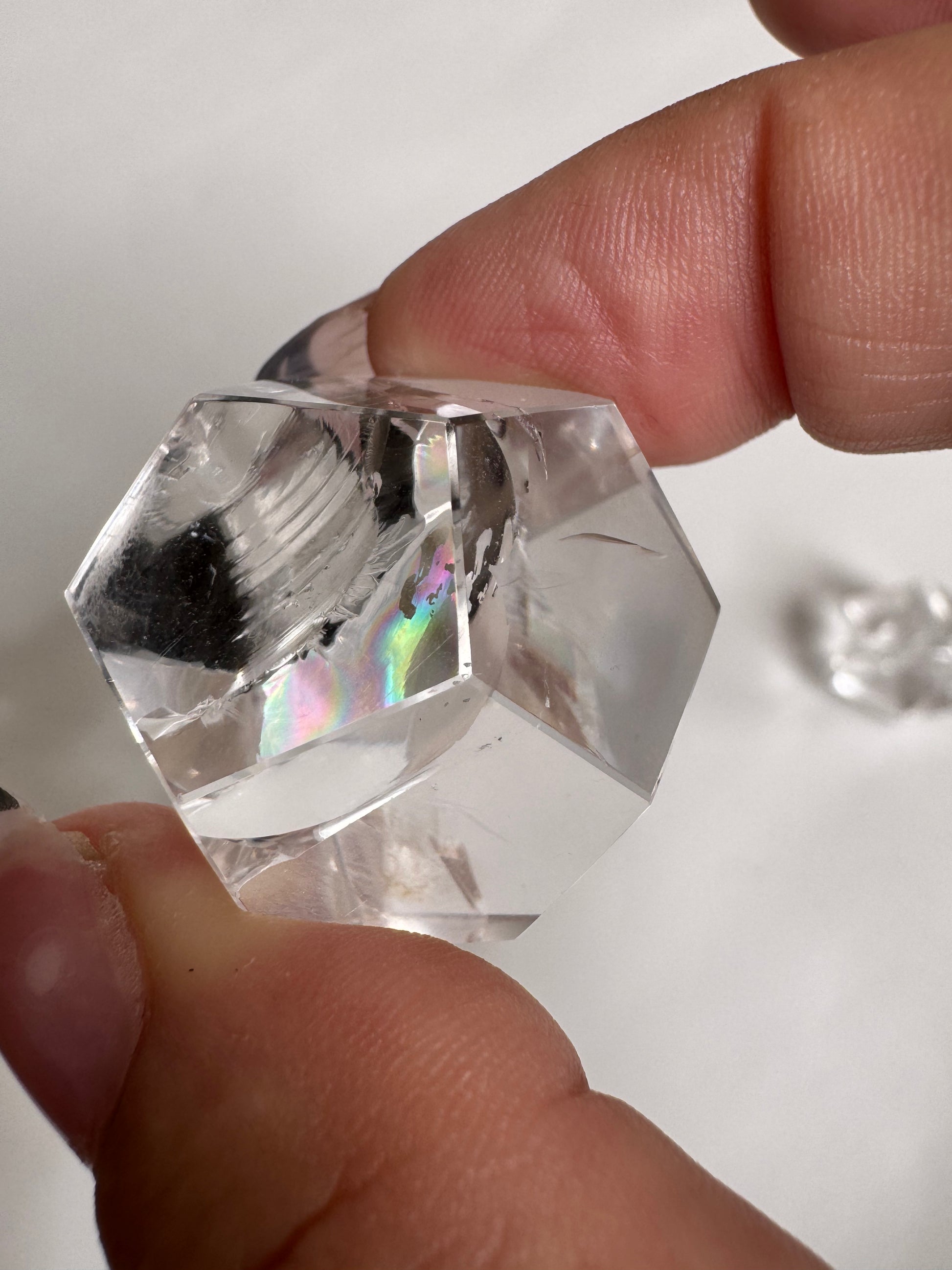 Lemurian Quartz Octahedron with prismatic reflections, ideal for crystal healing and energy toolkit applications.