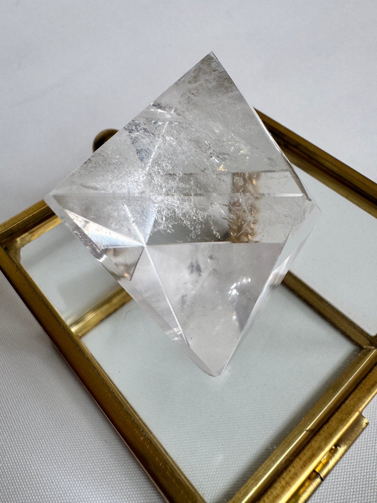 Angled Lemurian Quartz Octahedron with visible inclusions, ideal for spiritual growth and energy alignment rituals.