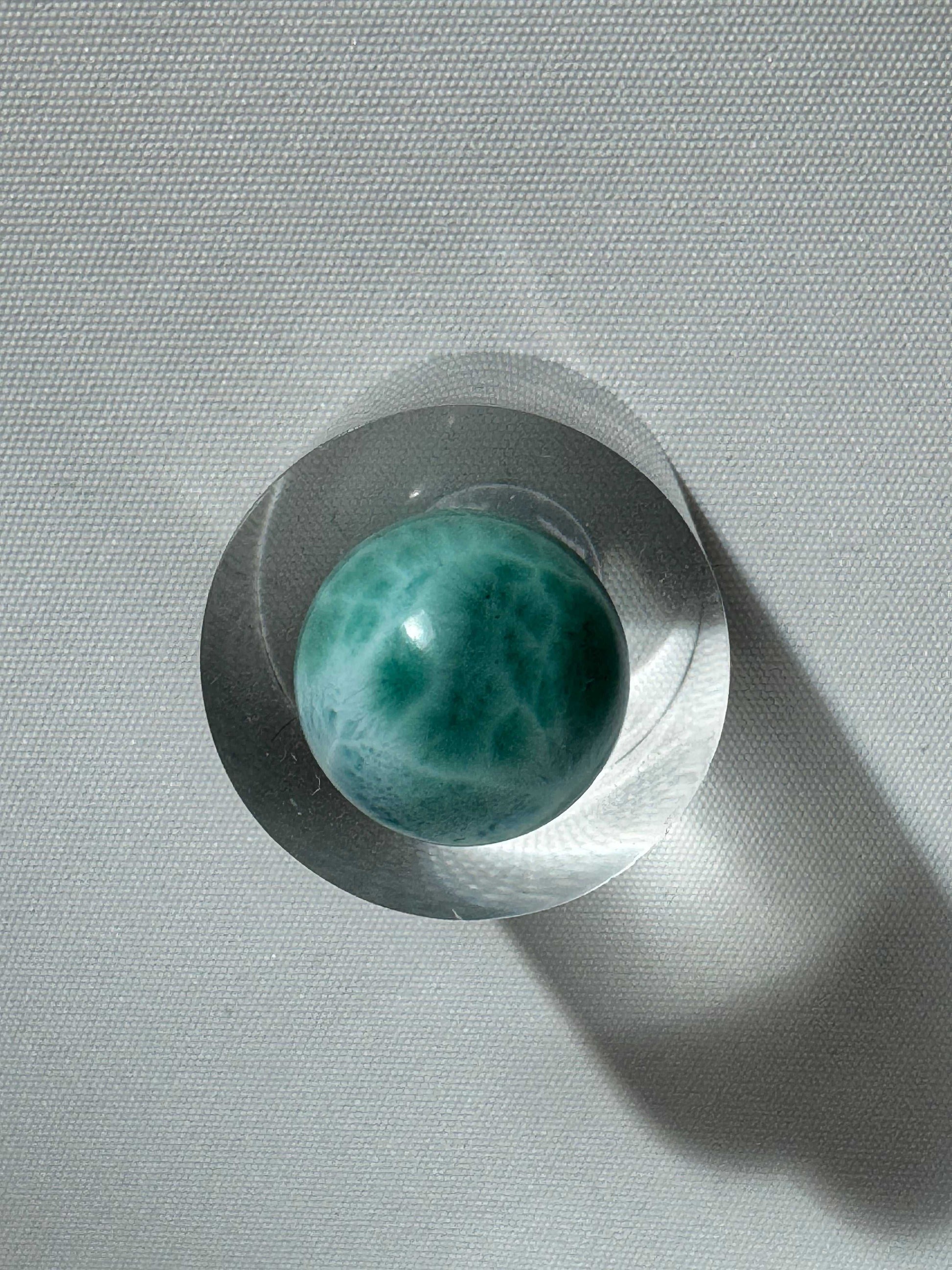Top view of Larimar gemstone mini sphere on acrylic base | Bespoke Crystals NZ