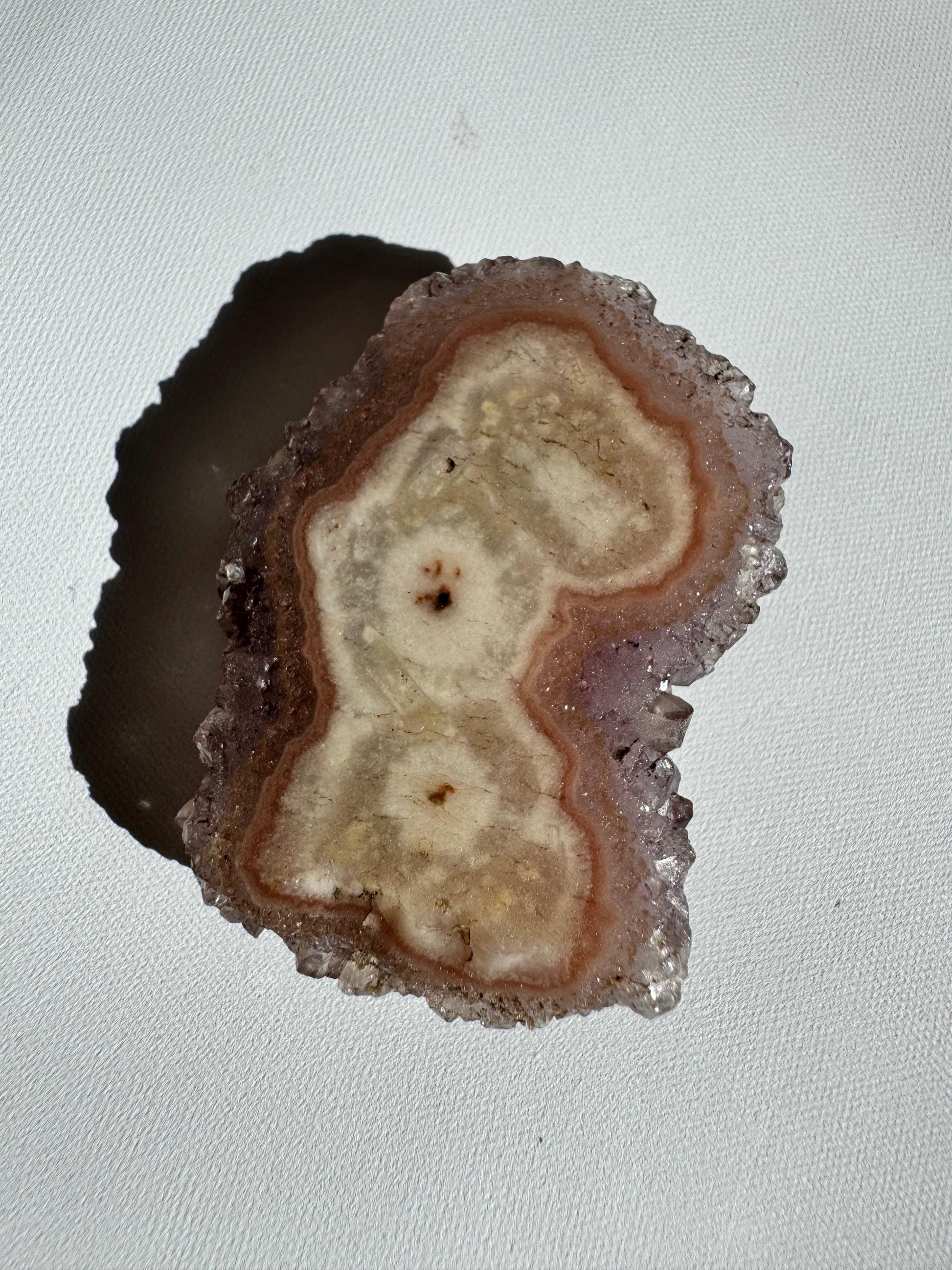 Amethyst Crystal Stalactite Grade A with unique cream and beige banding, a rare collectible rock specimen from Brazilian volcanic caves.