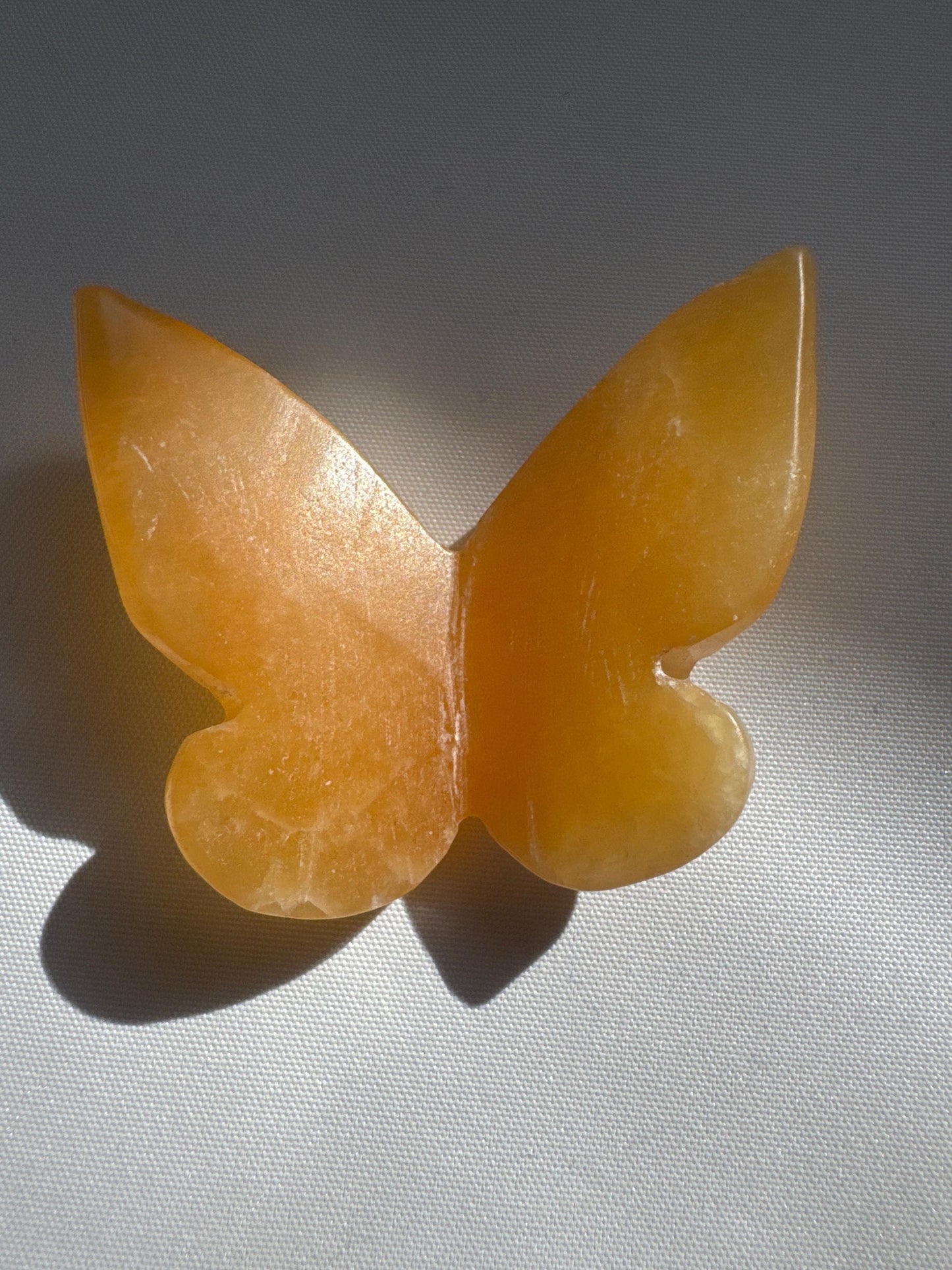 Orange Calcite Crystal 3D Butterfly with radiant golden-orange color, highlighting its handcrafted details and metaphysical appeal.