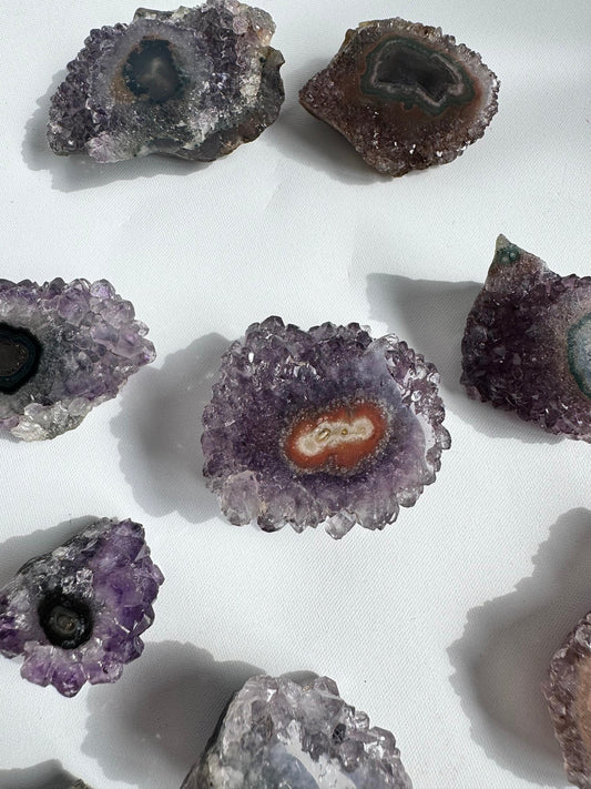 Collection of Amethyst Crystal Stalactites Grade A with vibrant violet cores and flower-like patterns, ideal for rock collectors and crystal enthusiasts.