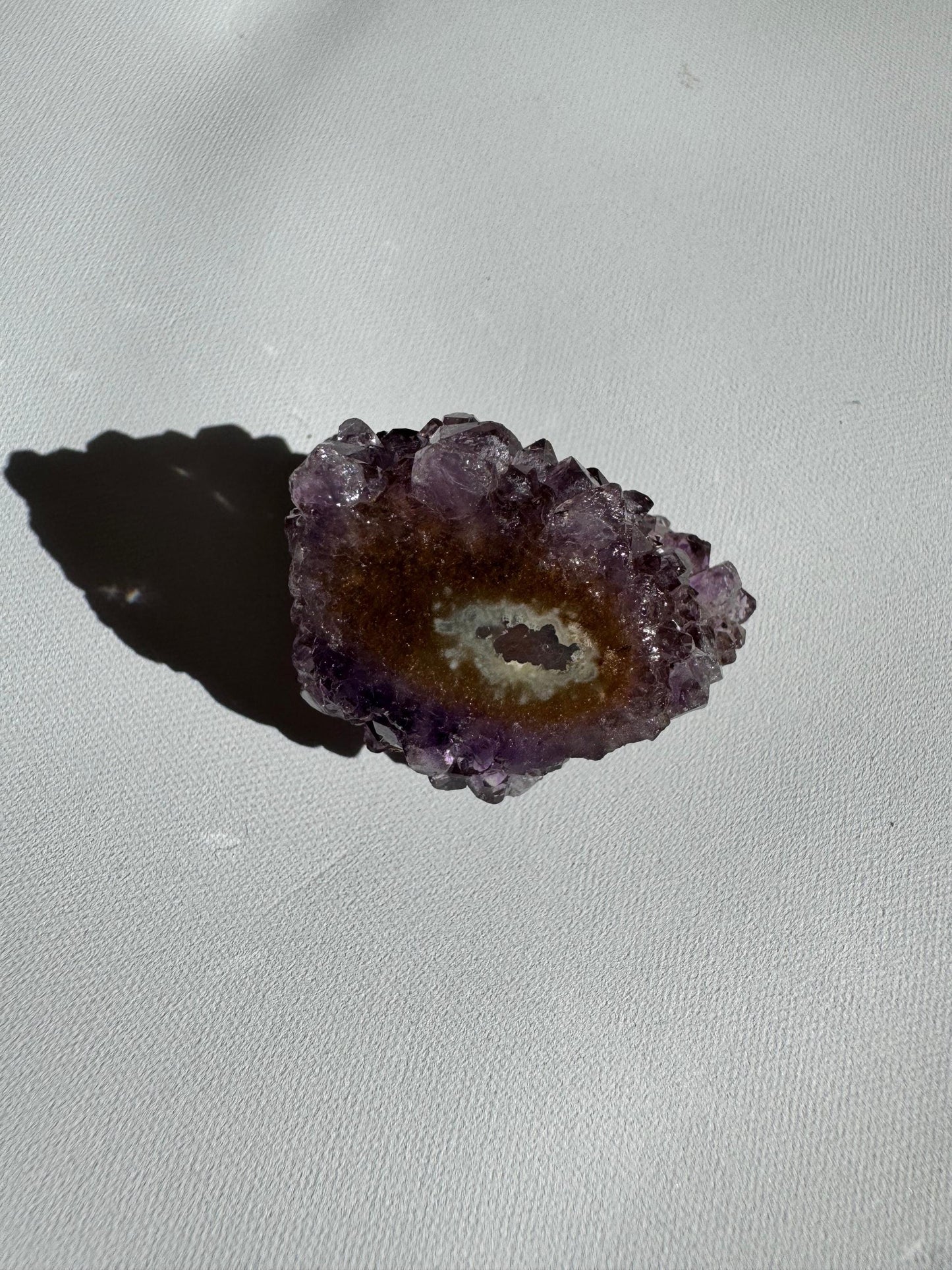 Small Amethyst Crystal Stalactite Grade A with subtle purple and brown hues, showcasing natural crystal growth and geode texture.